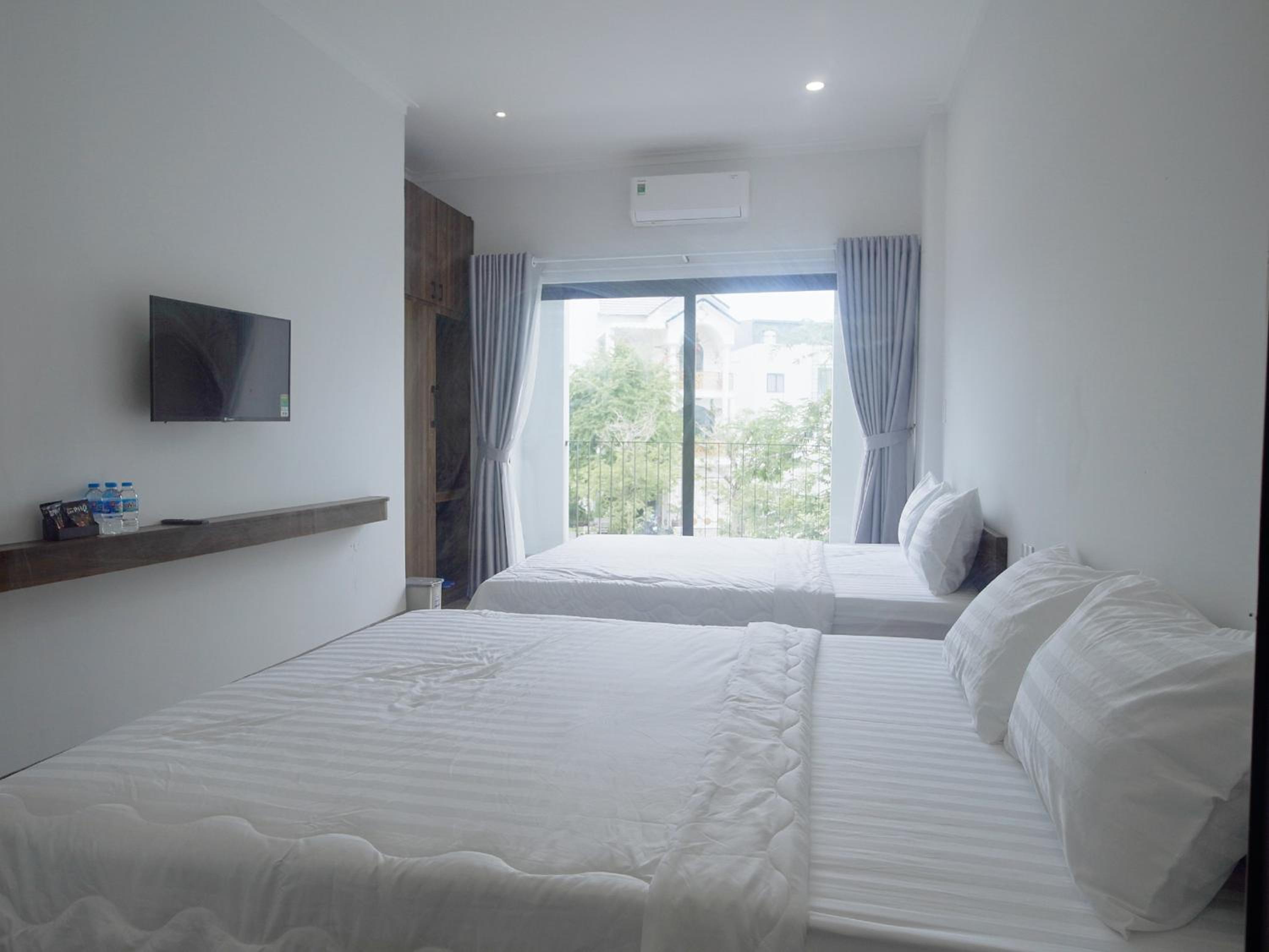Deluxe Quadruple Room - Photo 25