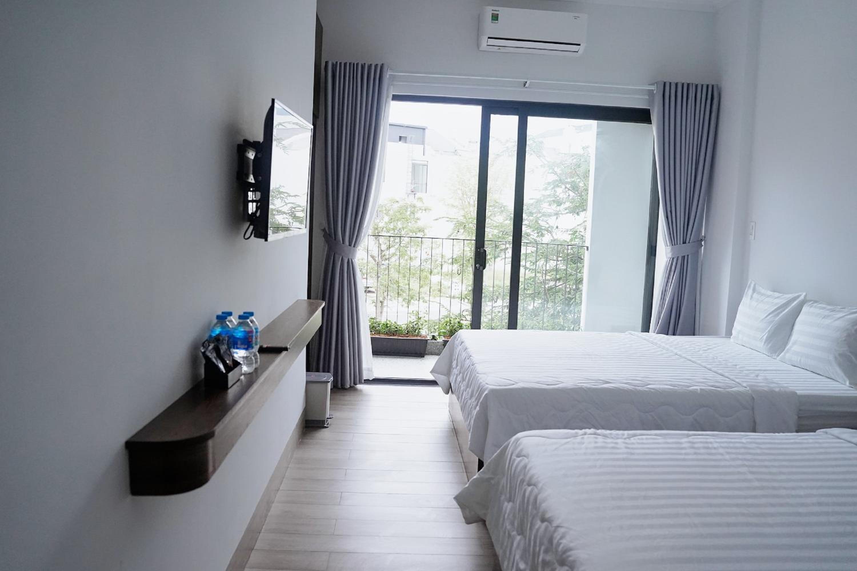 Deluxe Quadruple Room - Photo 27