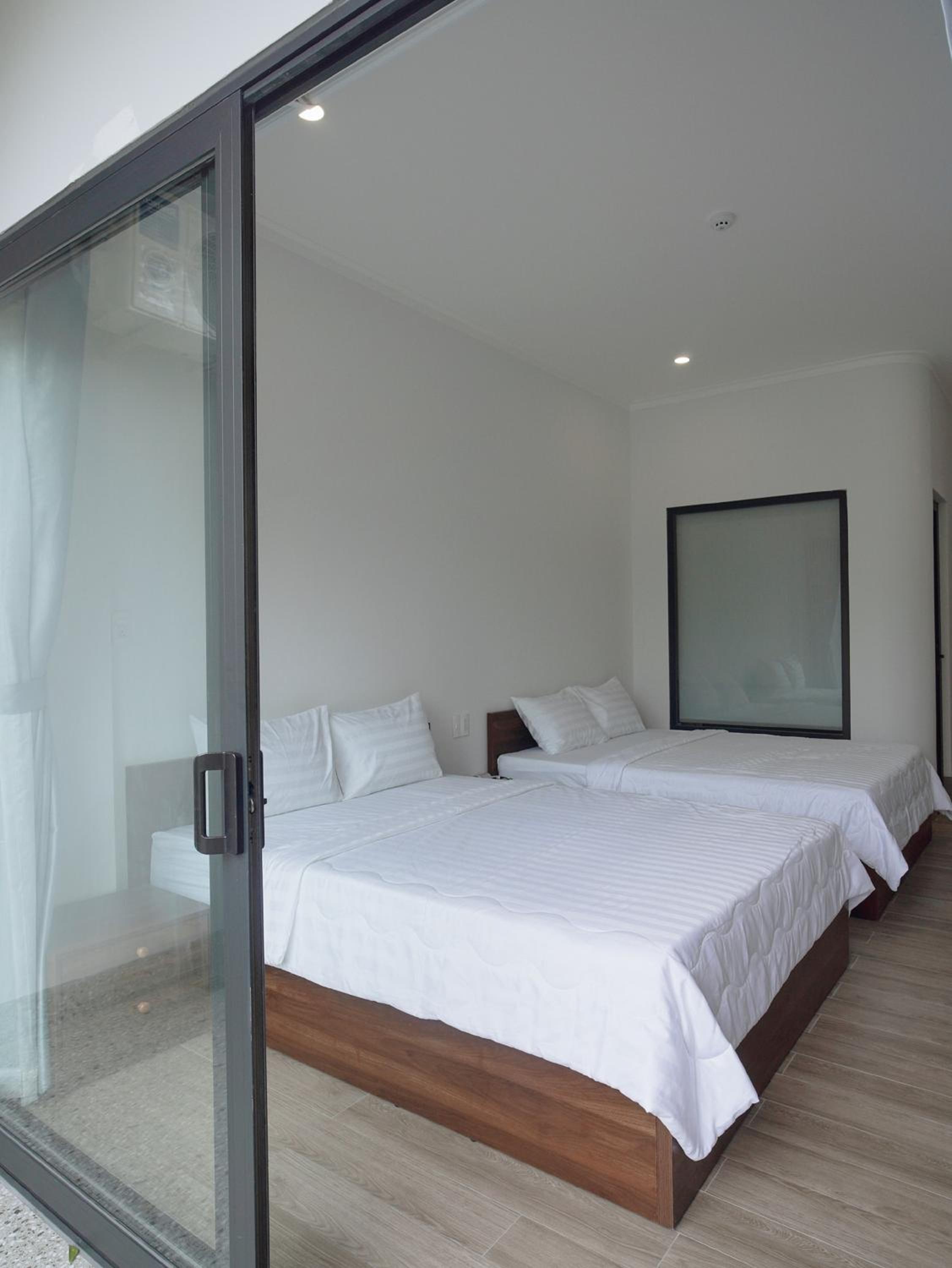 Deluxe Quadruple Room - Photo 23