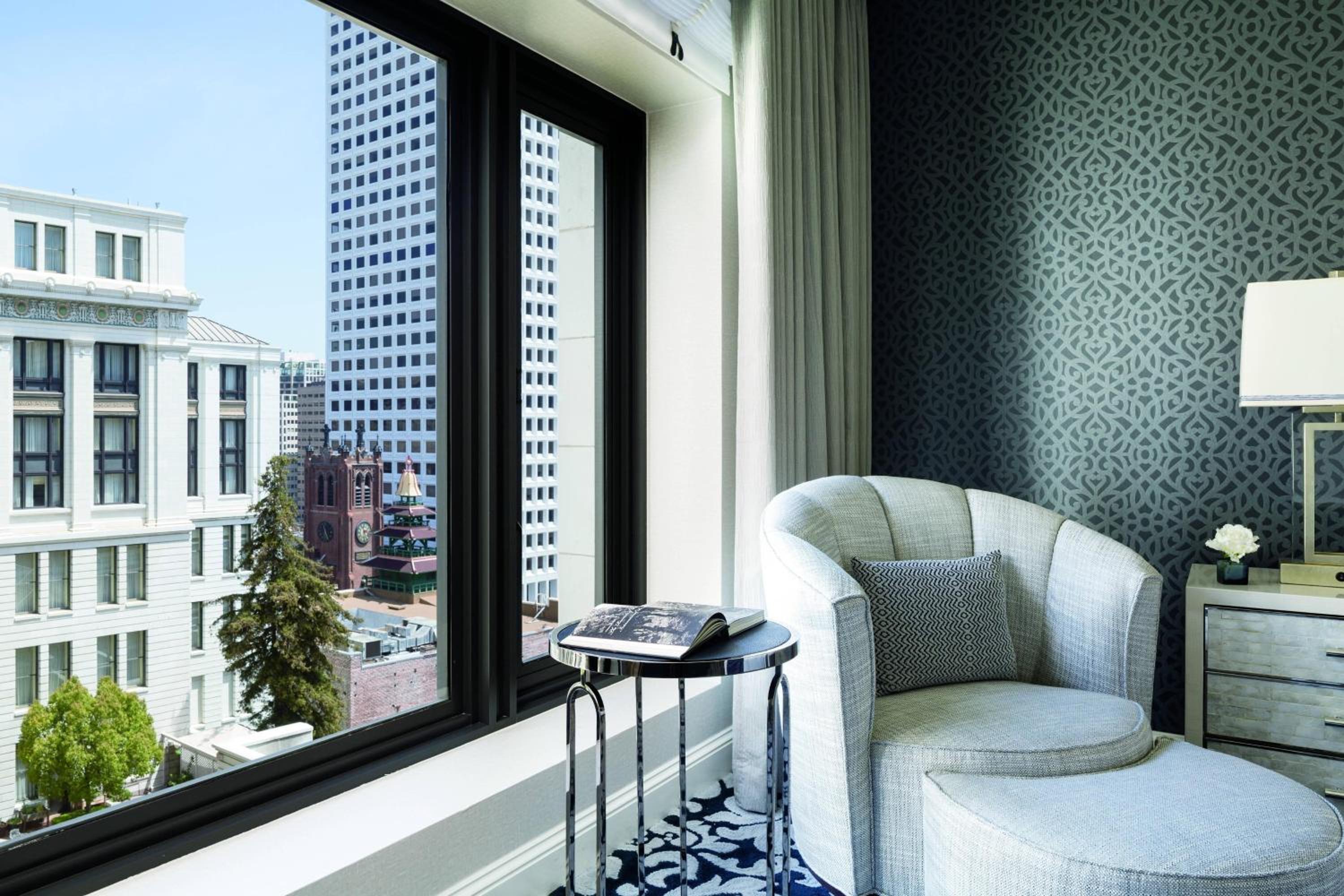chair in front of a window with a city view