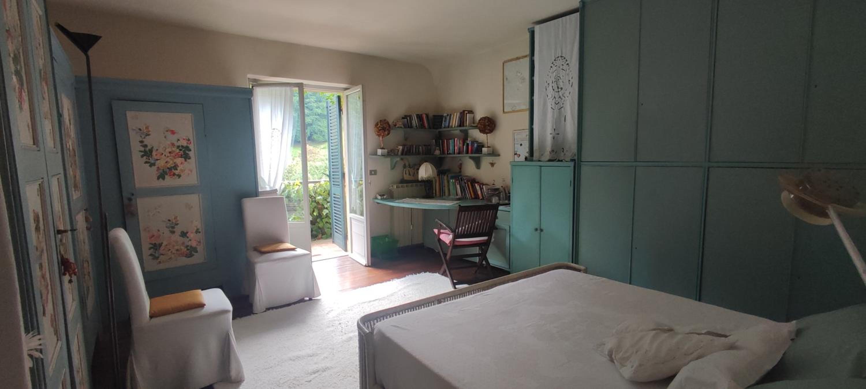 double bedroom with balcony photo 1