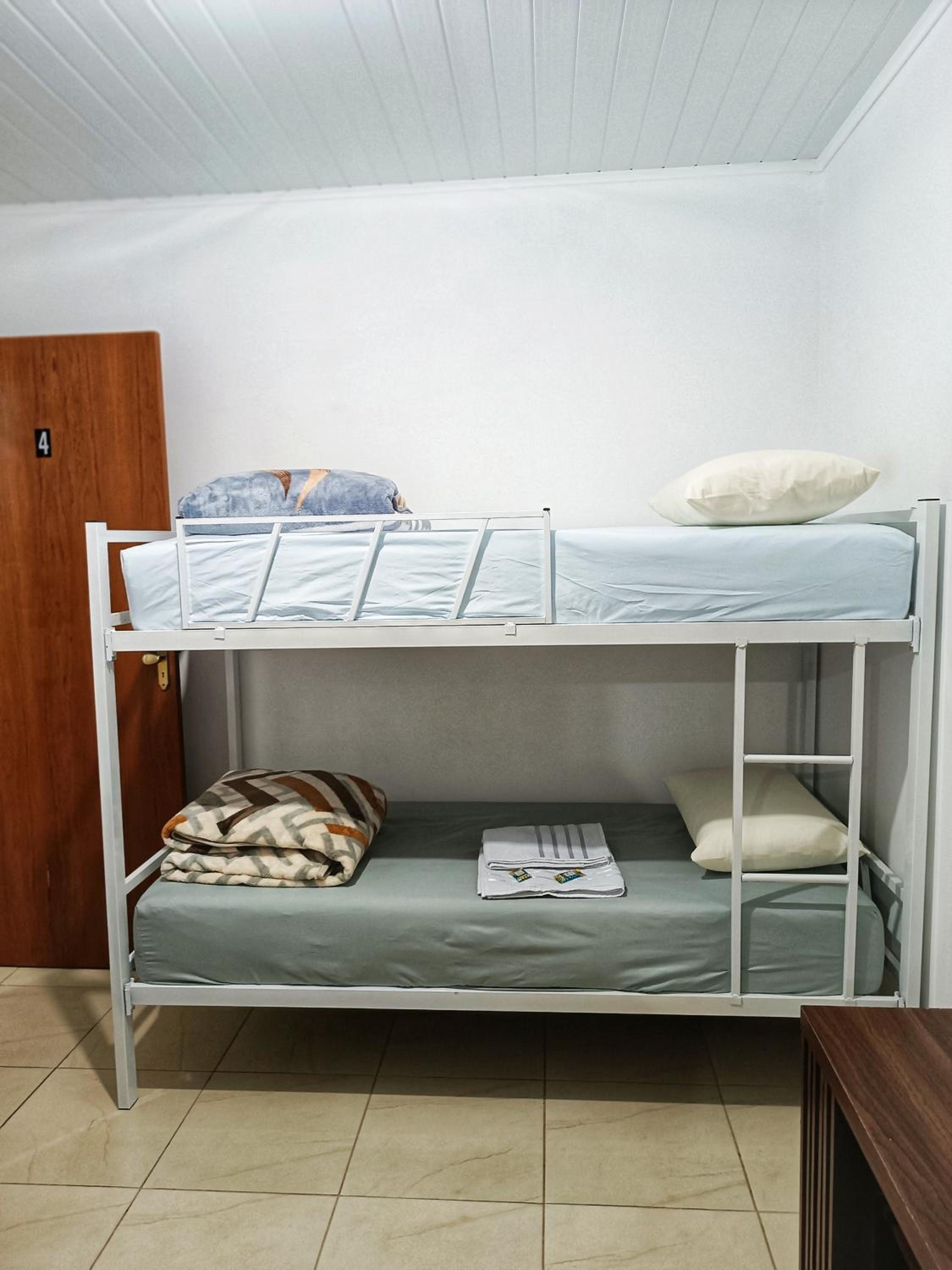 Single Bed In Male Dormitory Room With Shared Bathroom photo 1