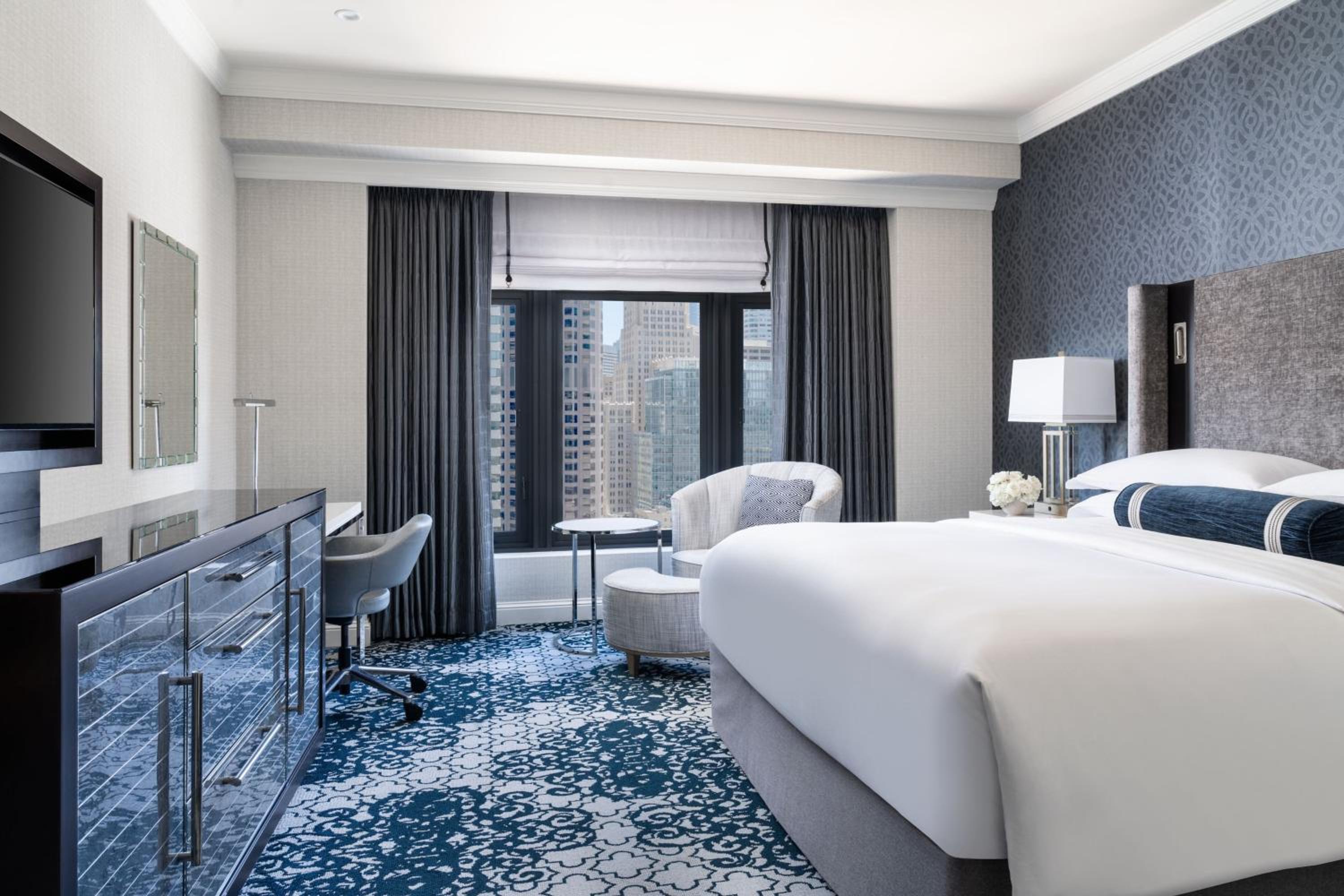 hotel room with a large bed and a flat screen tv