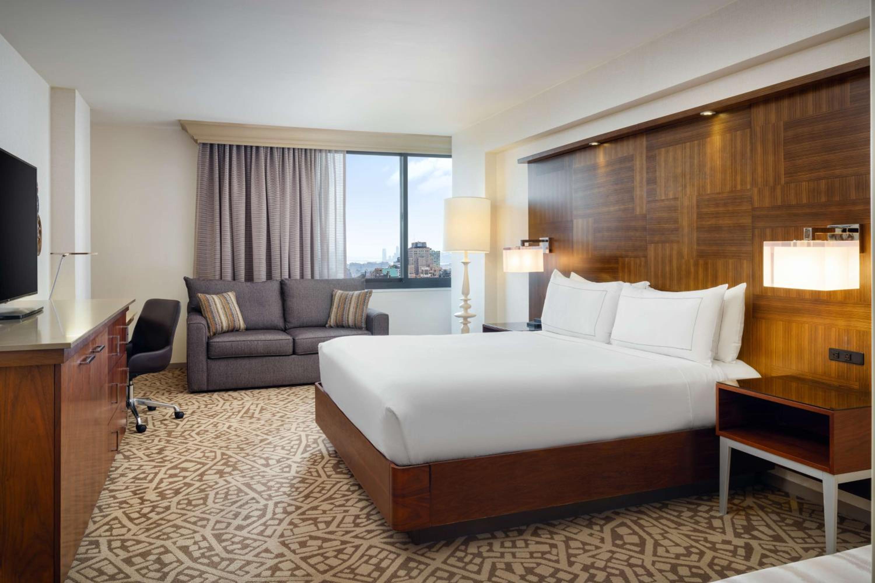 King Corner Studio Suite with Sofa Bed and City View