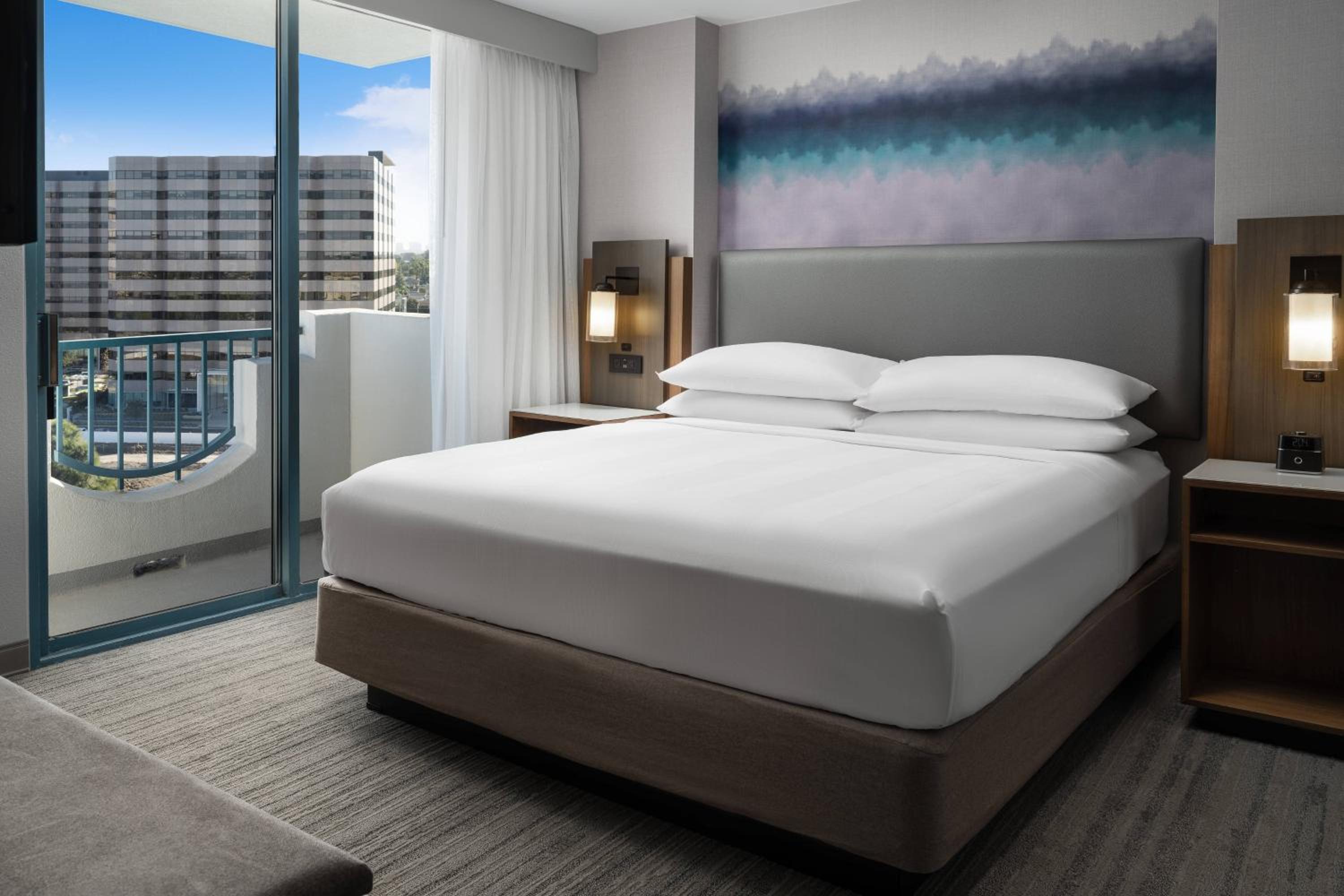 One Bedroom King Suite with Sofa, City View and Balcony