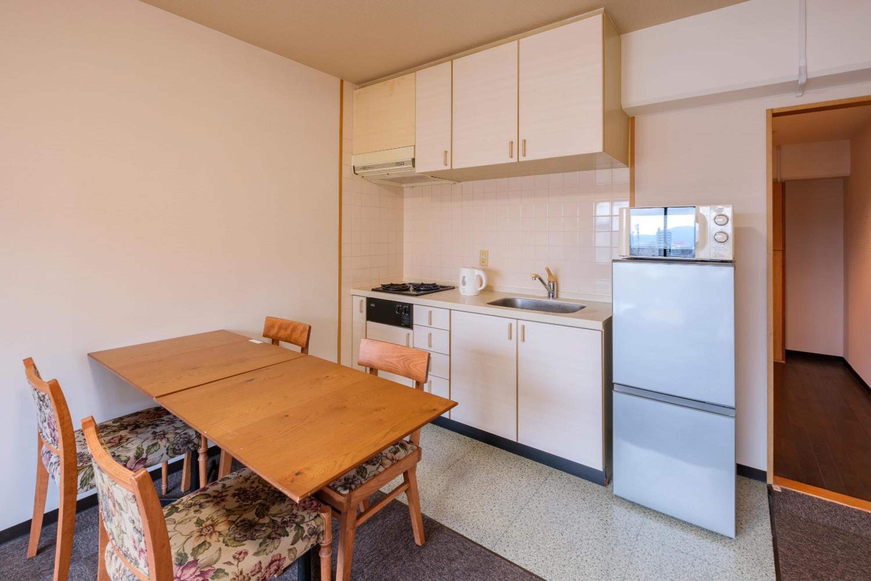 Junior Suite Room (2 Small Double Beds and 1 Sofa) with Kitchen - Non-Smoking - Cleaning Fee Extra - No Cleaning for Consecutive Night Stays photo 3