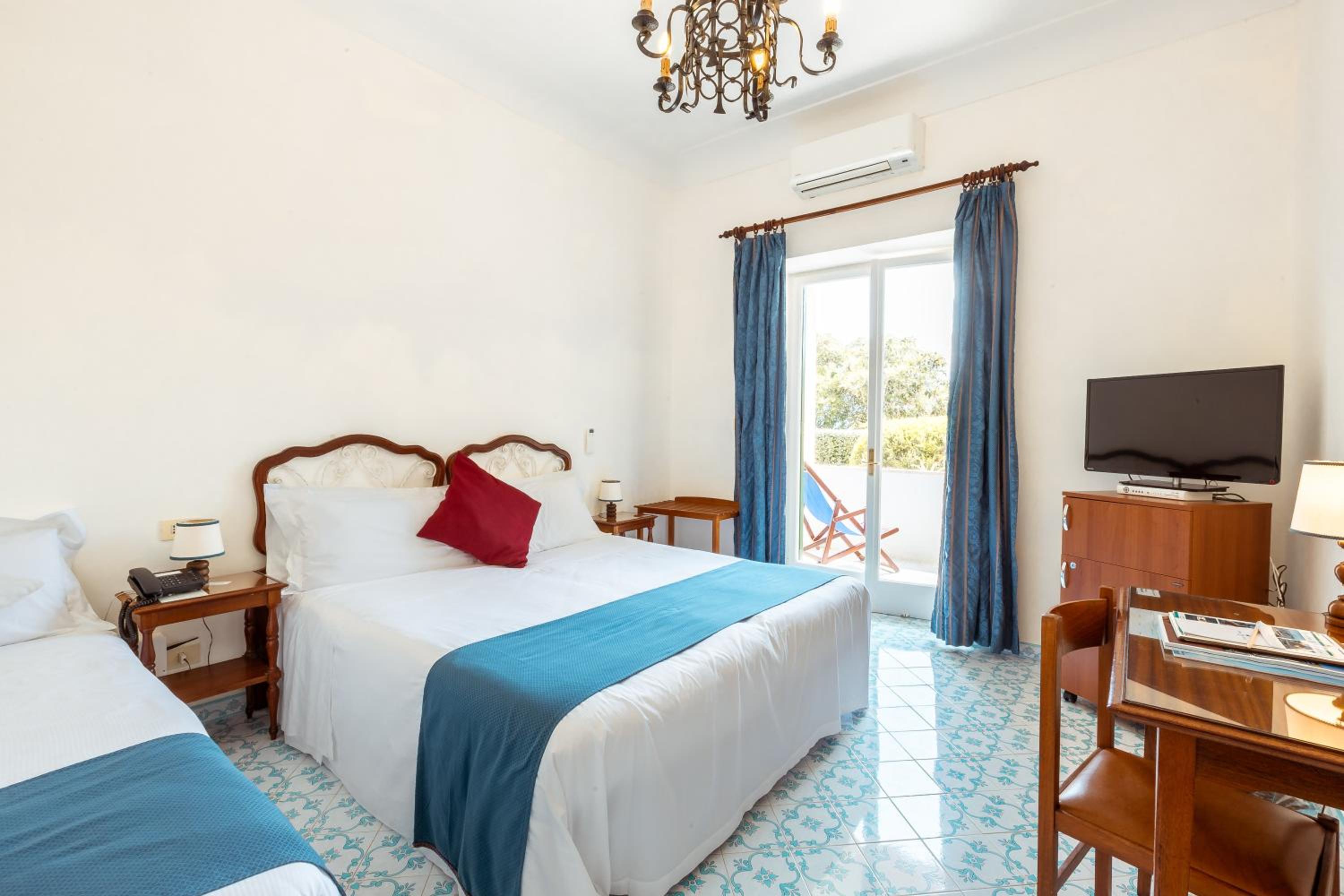 Superior Triple Room with Balcony and Garden View