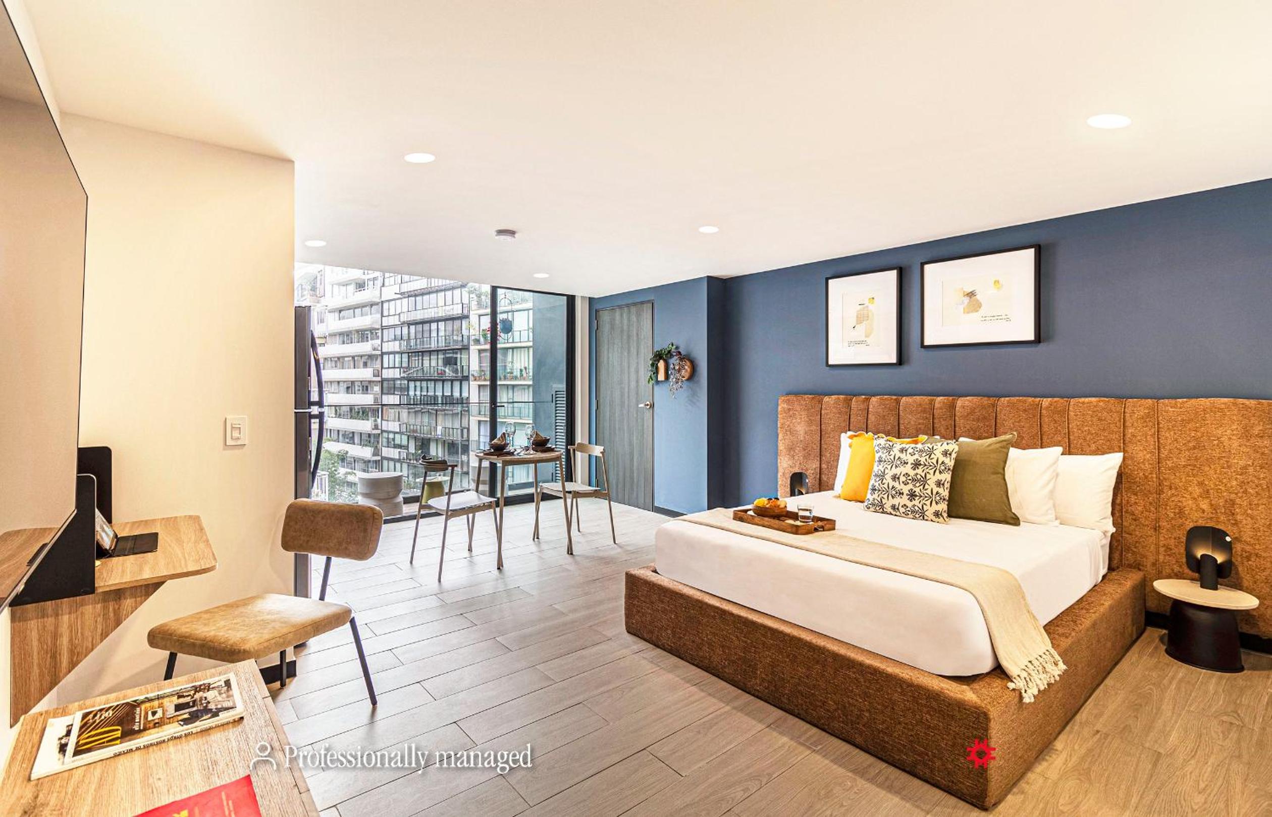 Studio apartment with queen bed and balcony