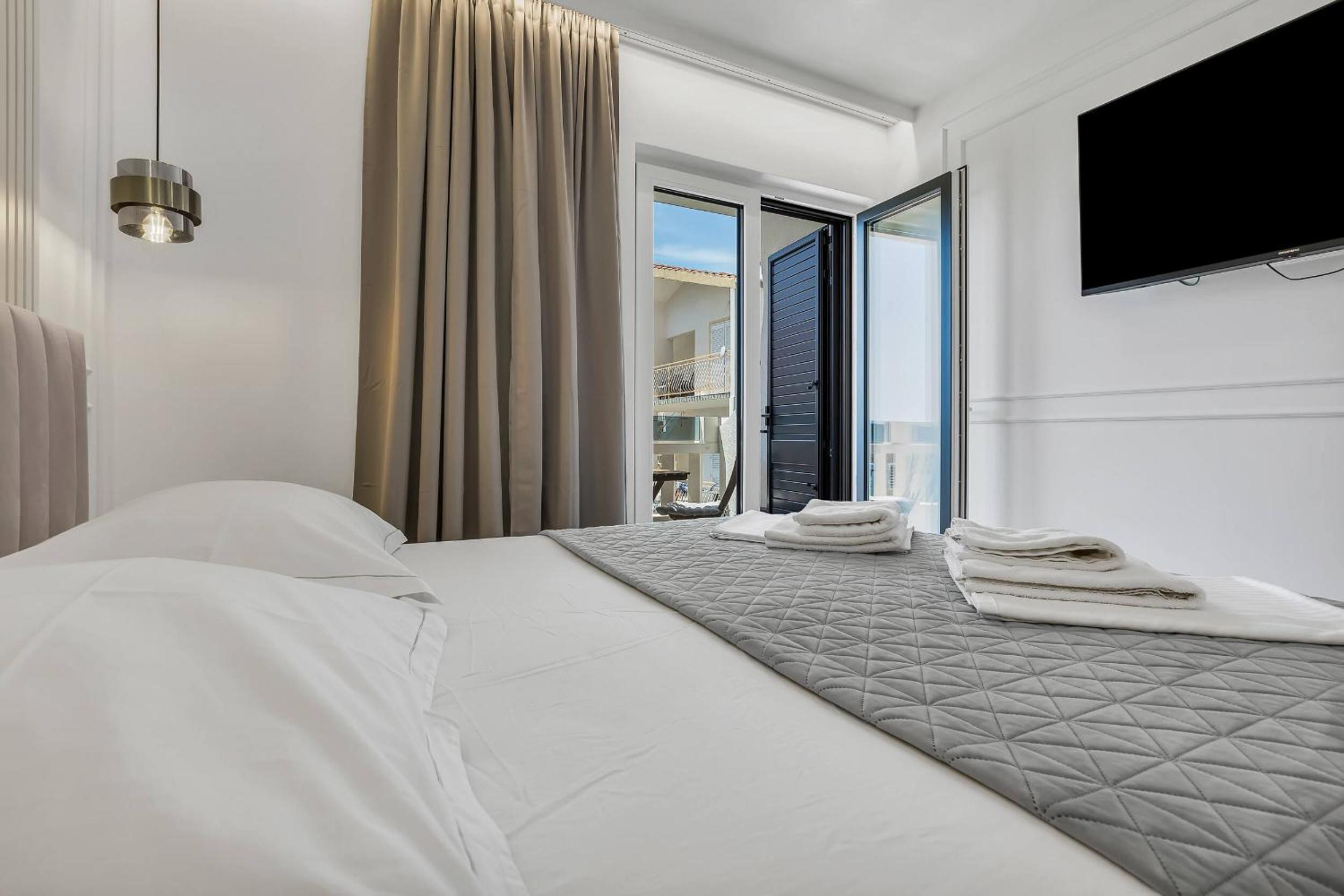 Three-Bedroom Apartment with Balcony and Sea View