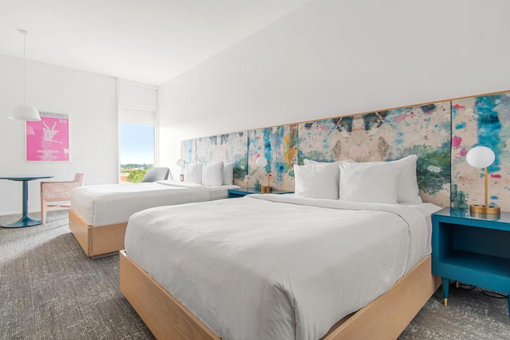 Deluxe Queen Room with Two Queen Beds - Photo 1