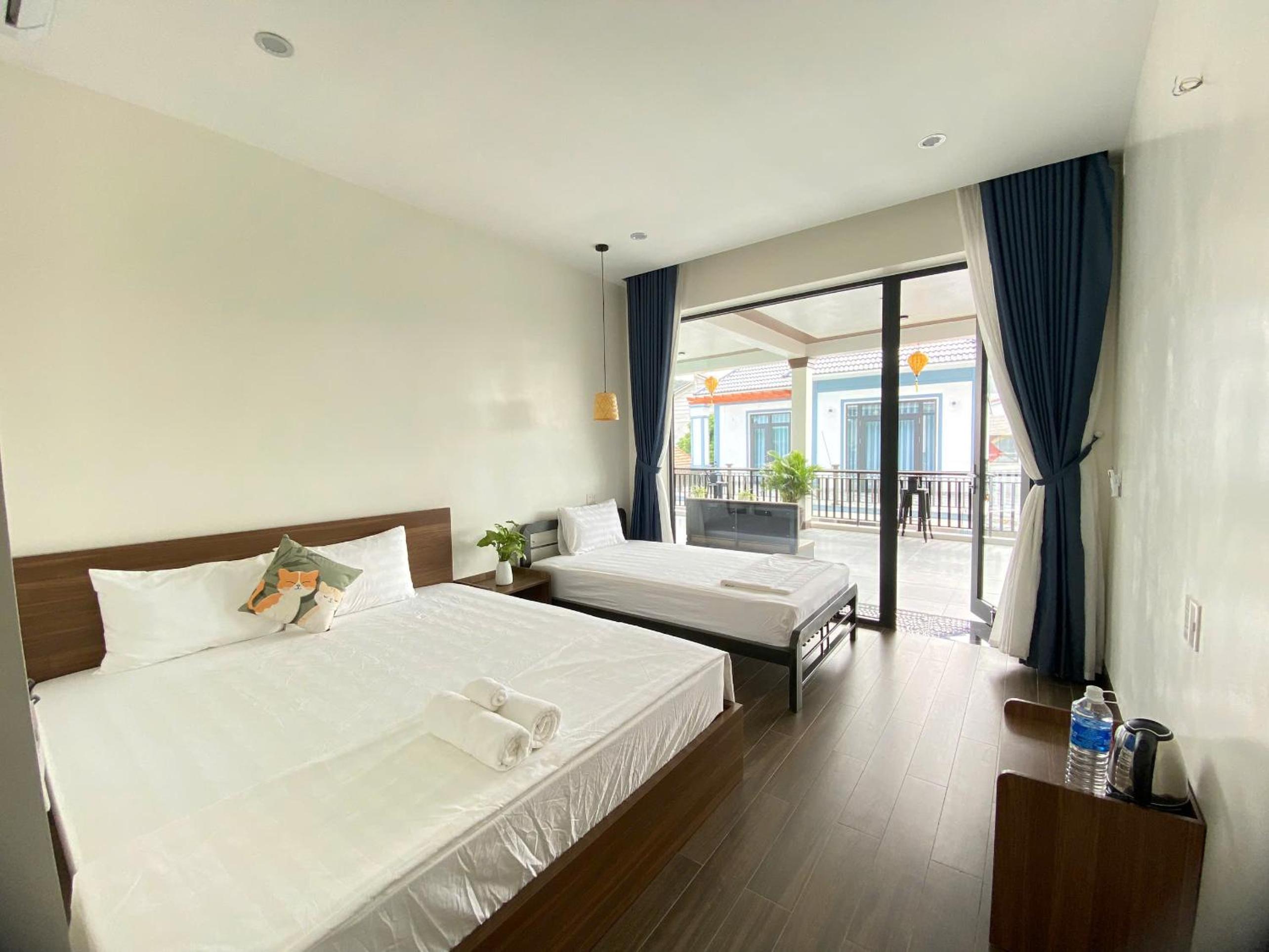 Deluxe Triple Room - Photo 7