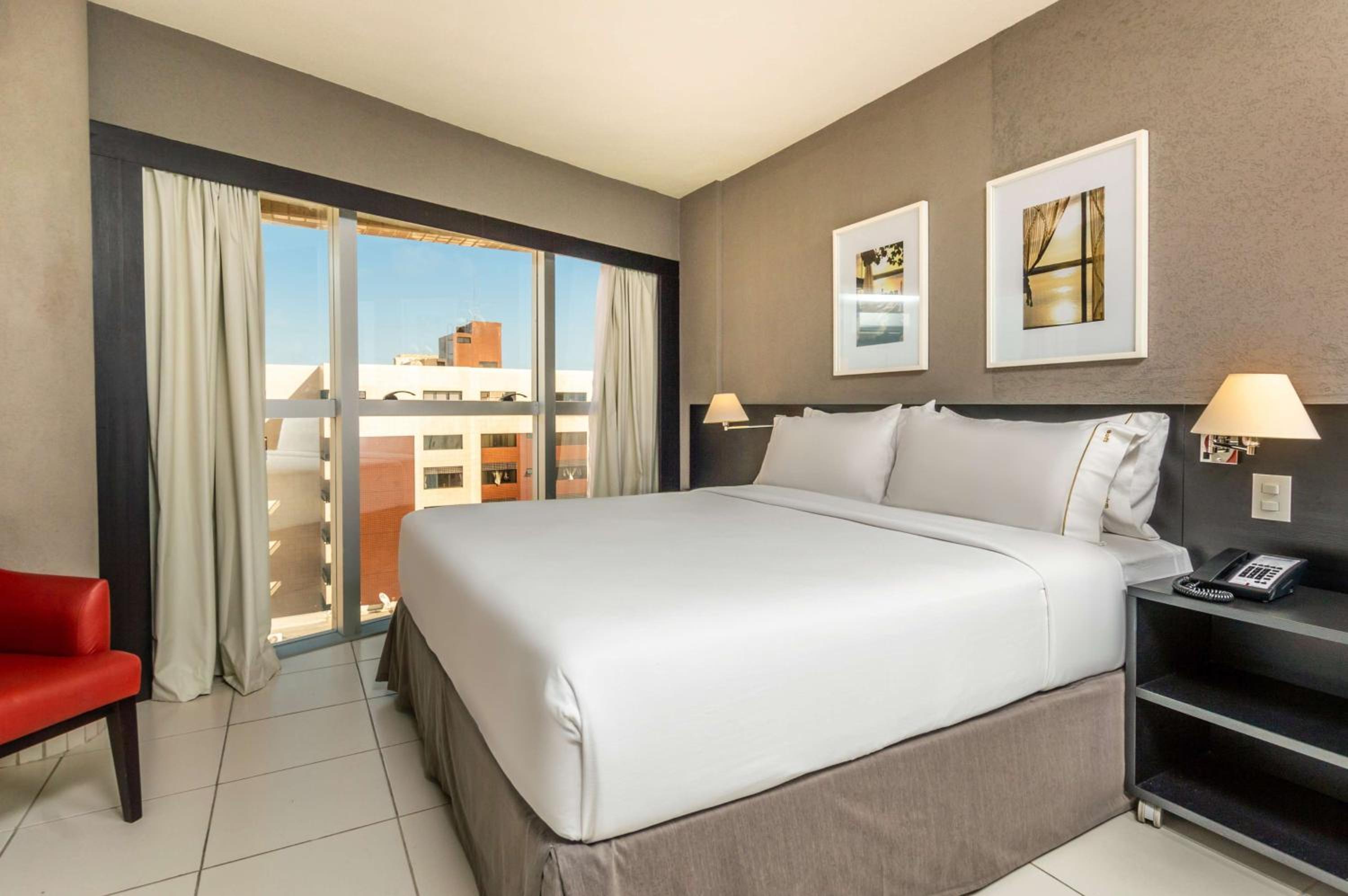 Corner King Room with Partial Ocean View - Photo 1
