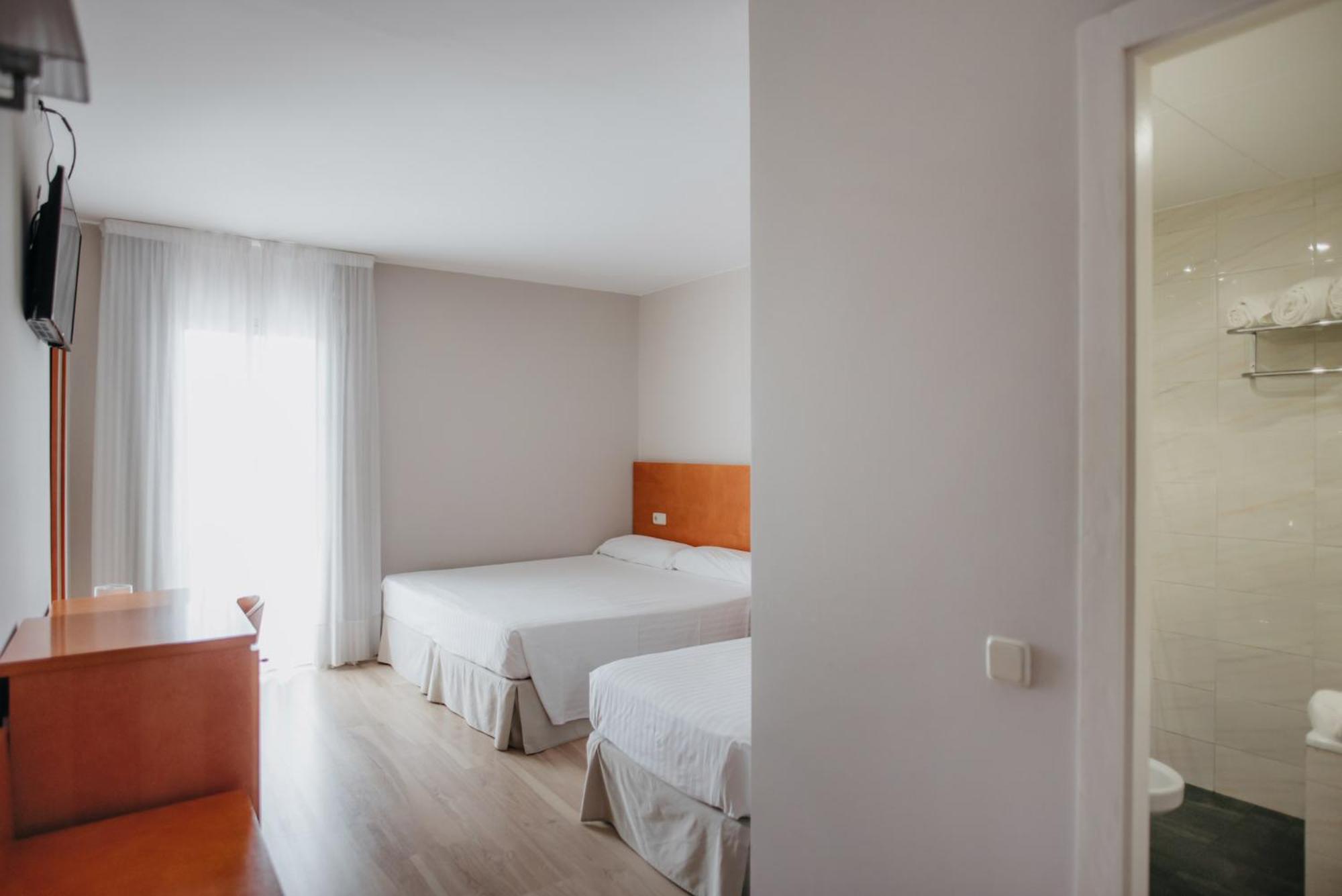 Habitación Triple con Balcón