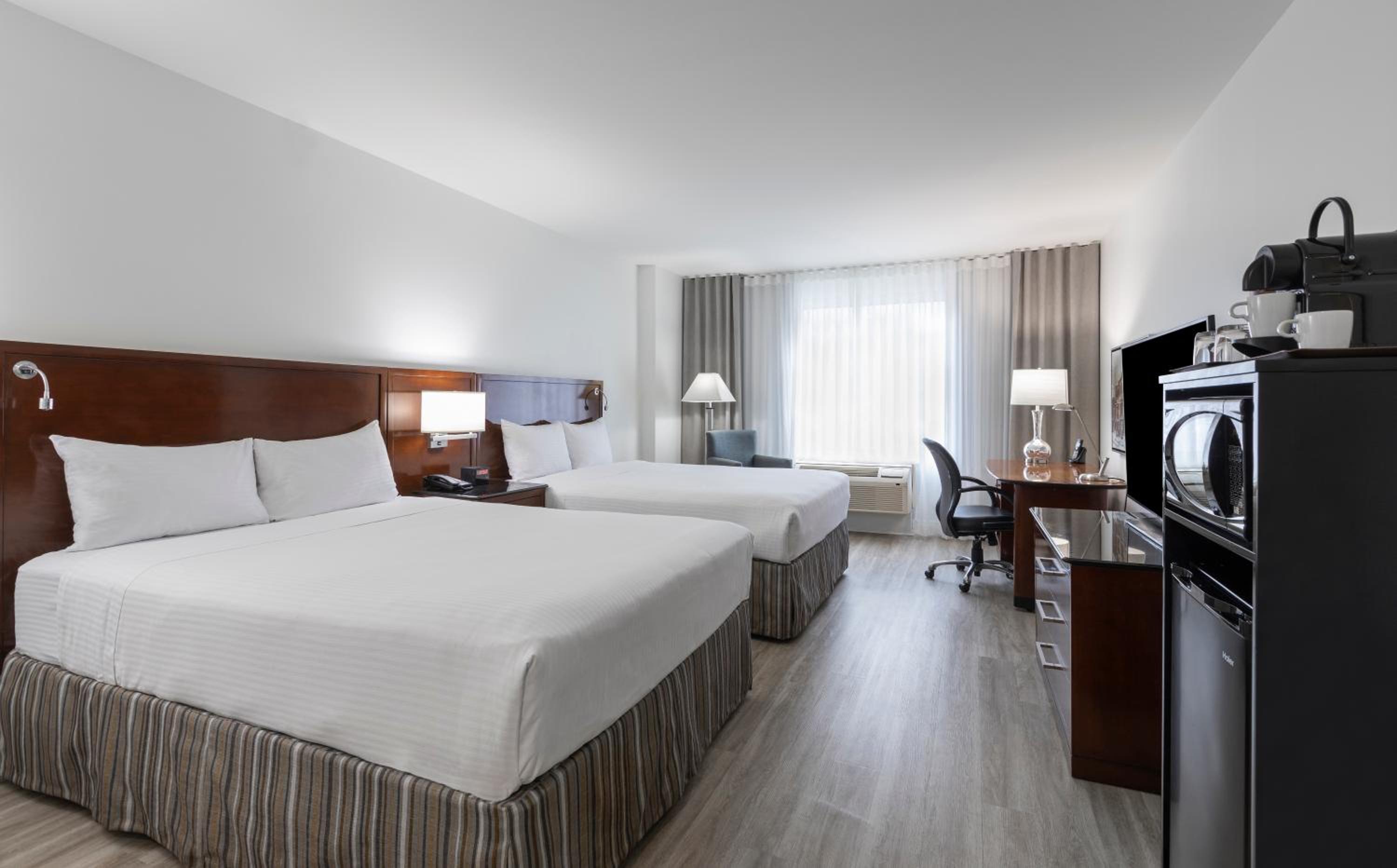 Queen Room with Two Queen Beds - Photo 1