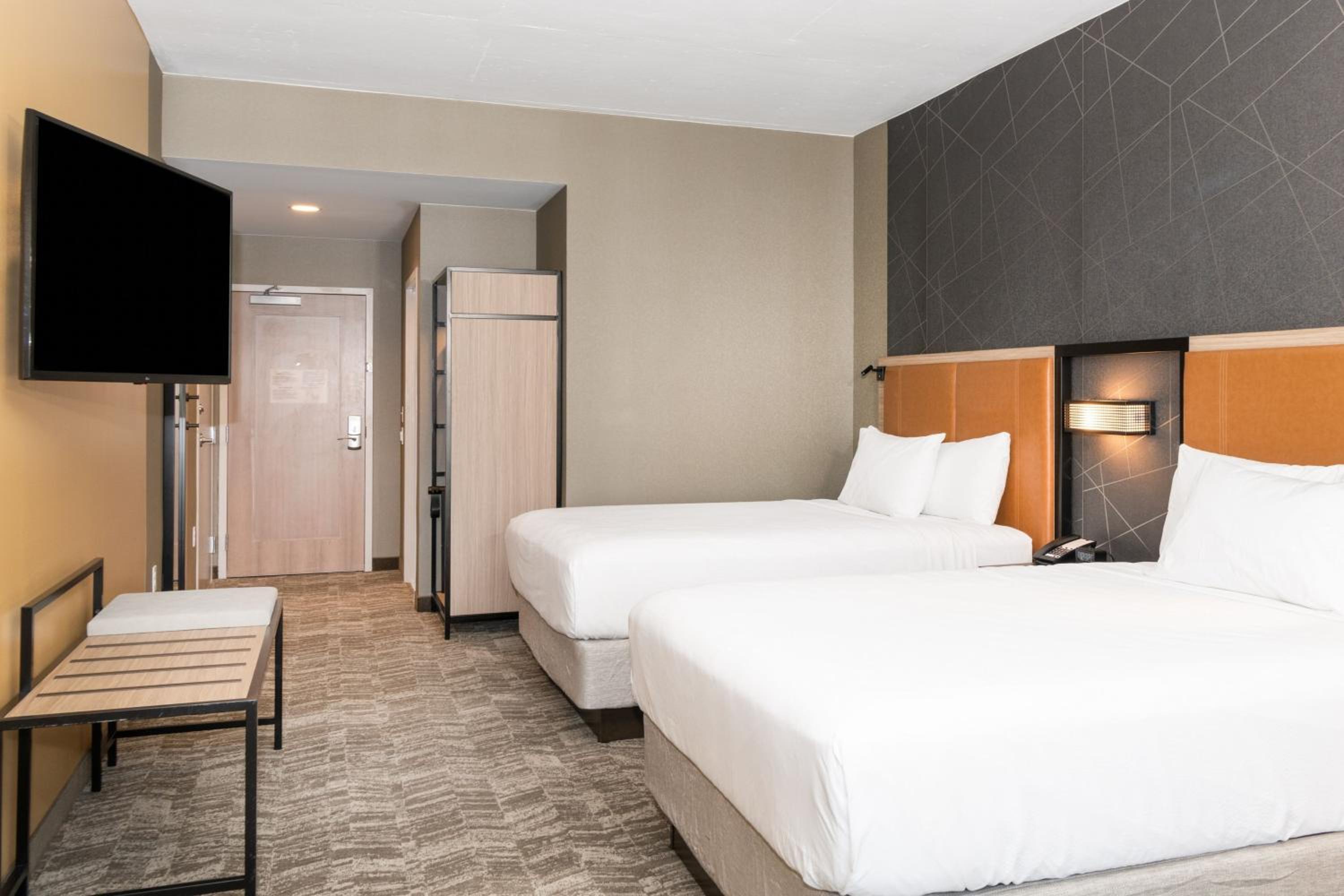 Queen Room with Two Queen Beds and Trundle Sofa - Photo 1