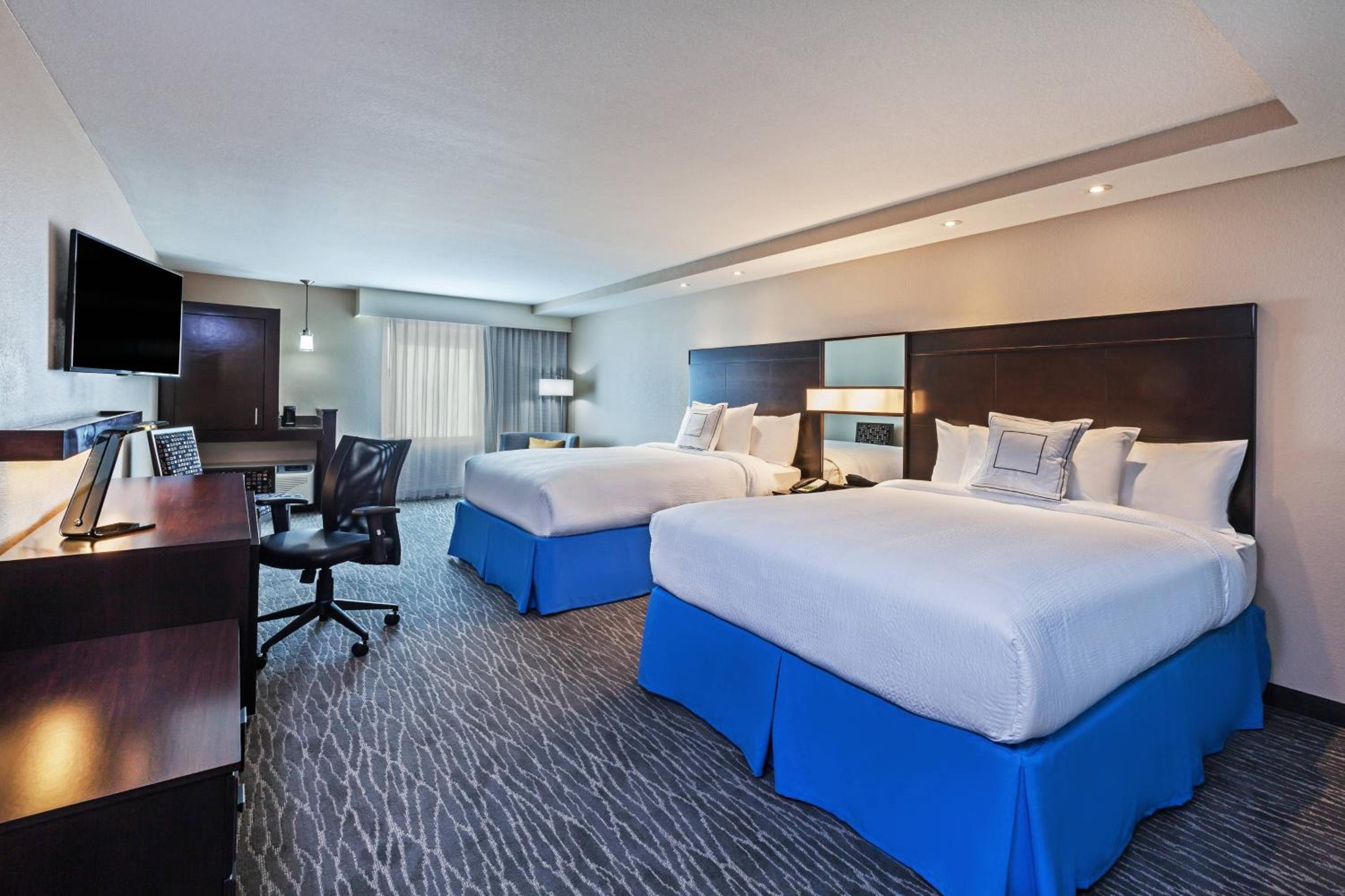 Queen Room with Two Queen Beds - Hearing Accessible photo 1