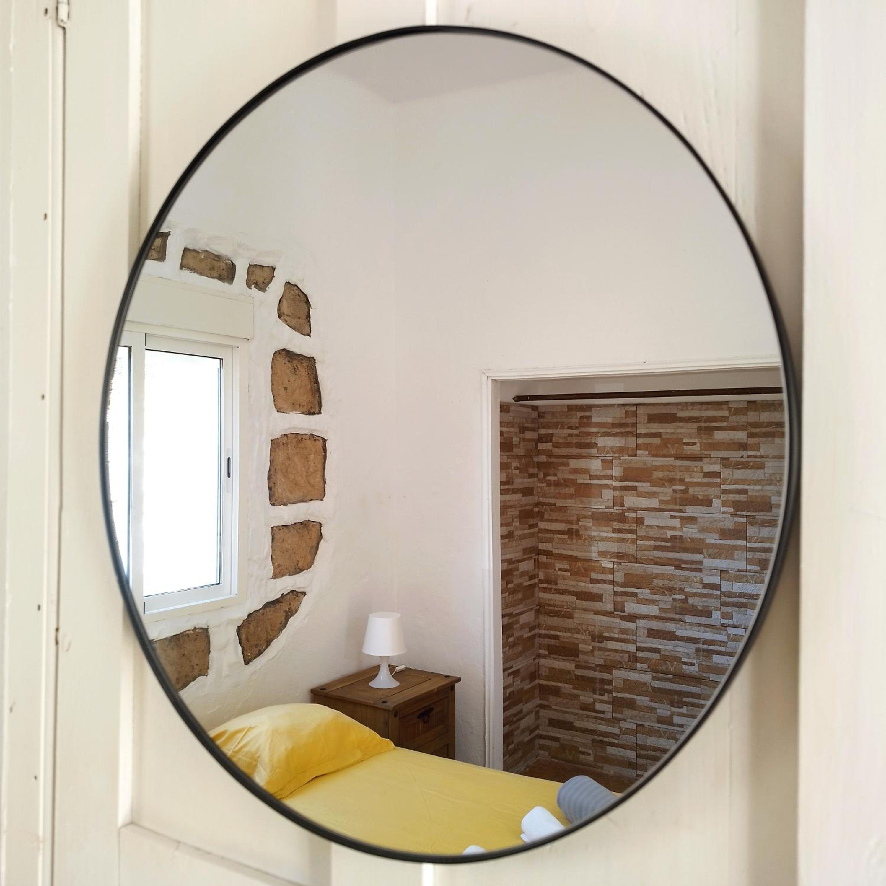 Habitación Triple con Baño Compartido