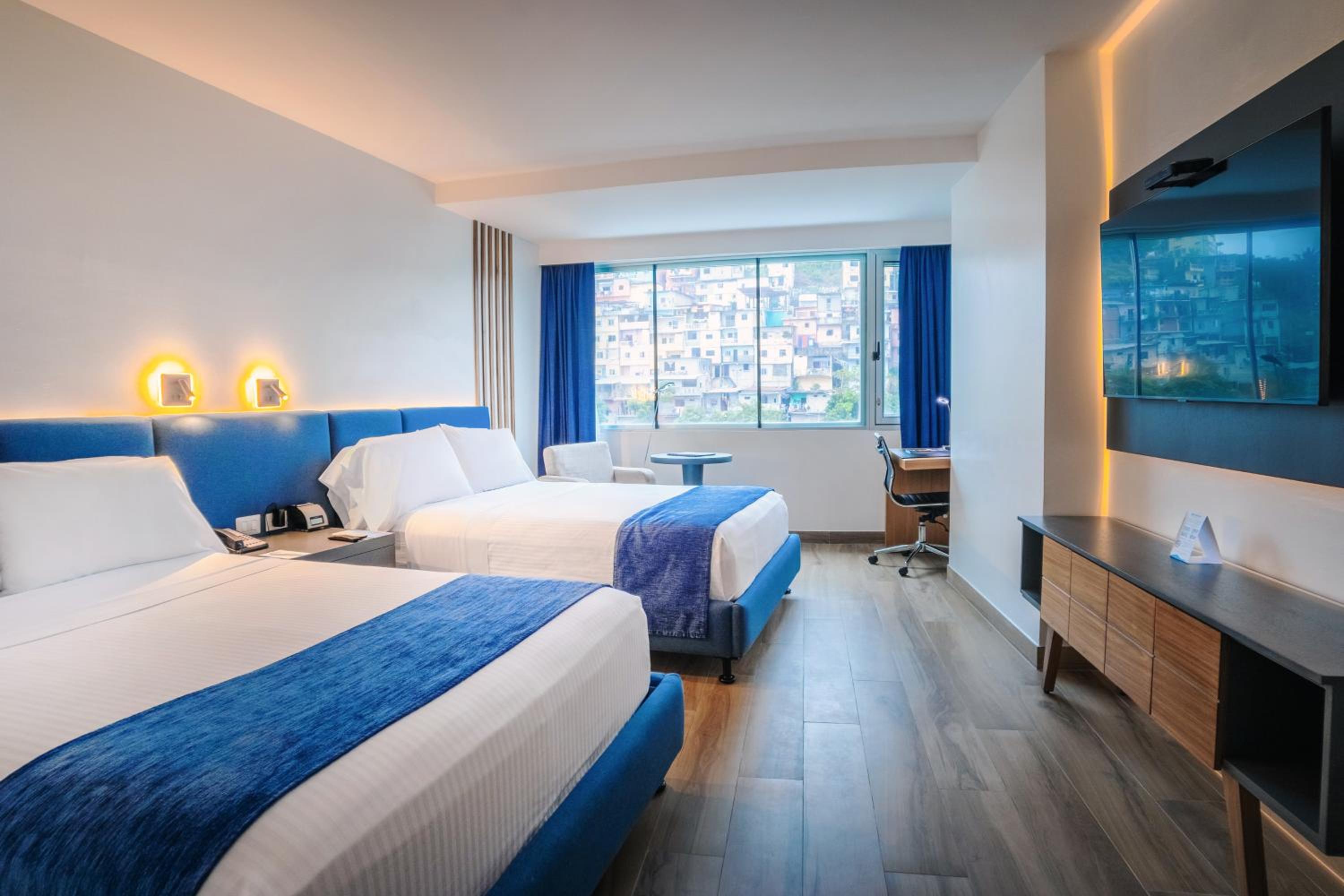 Room with Two Double Beds and City View