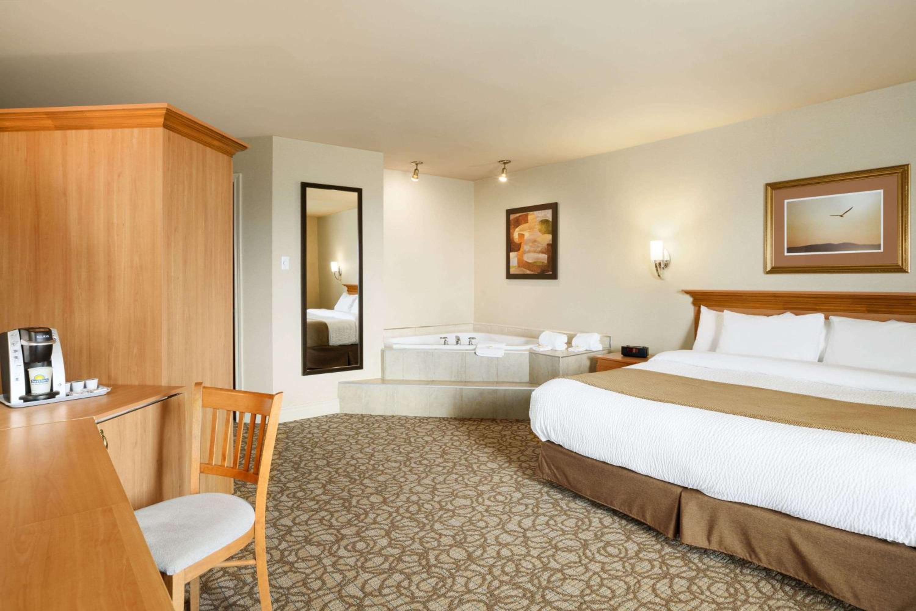 Room with One King Bed and One Queen Murphy Bed, Balcony - Non-Smoking photo 1