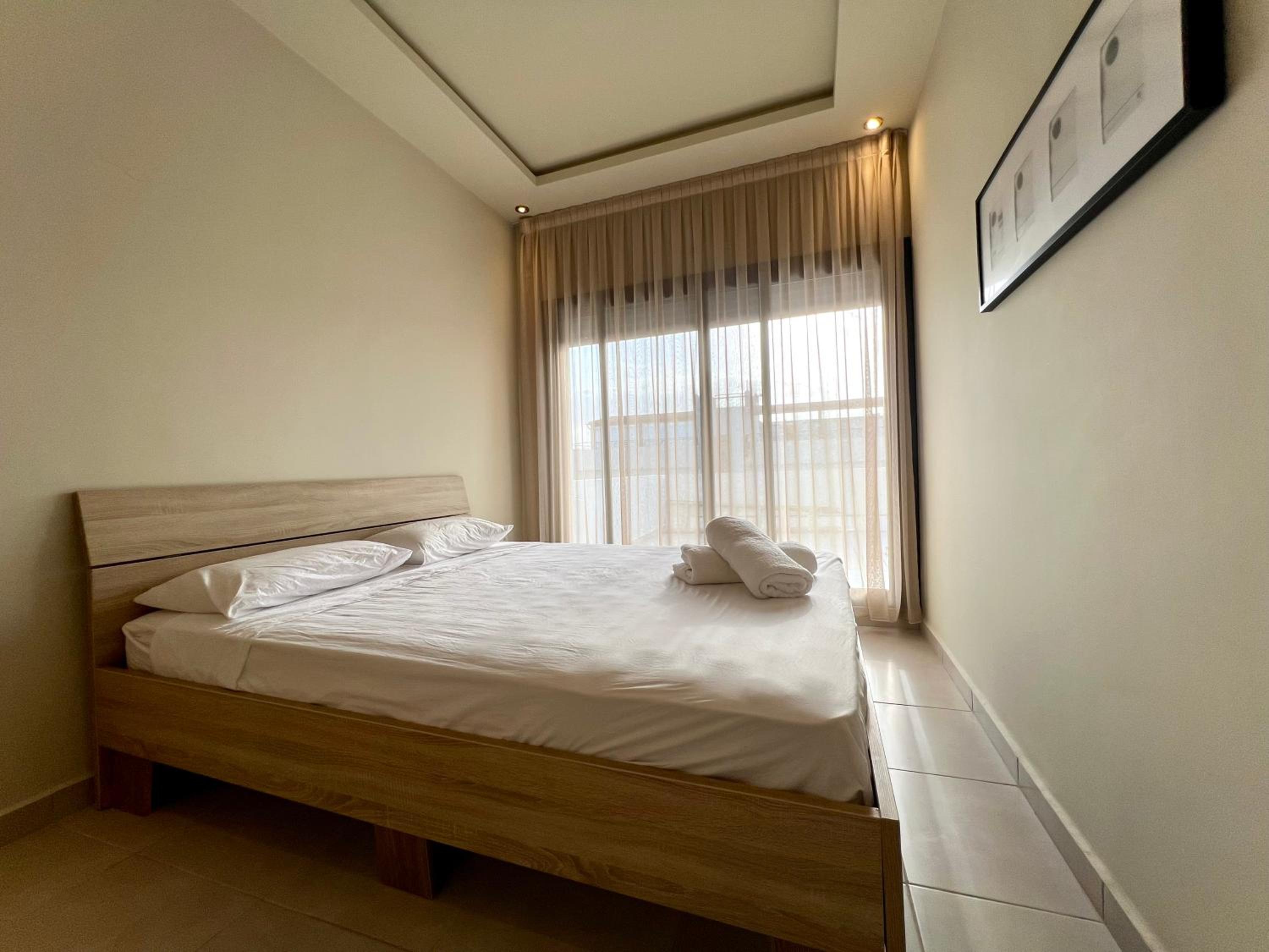 One-Bedroom Apartment with Balcony and City View