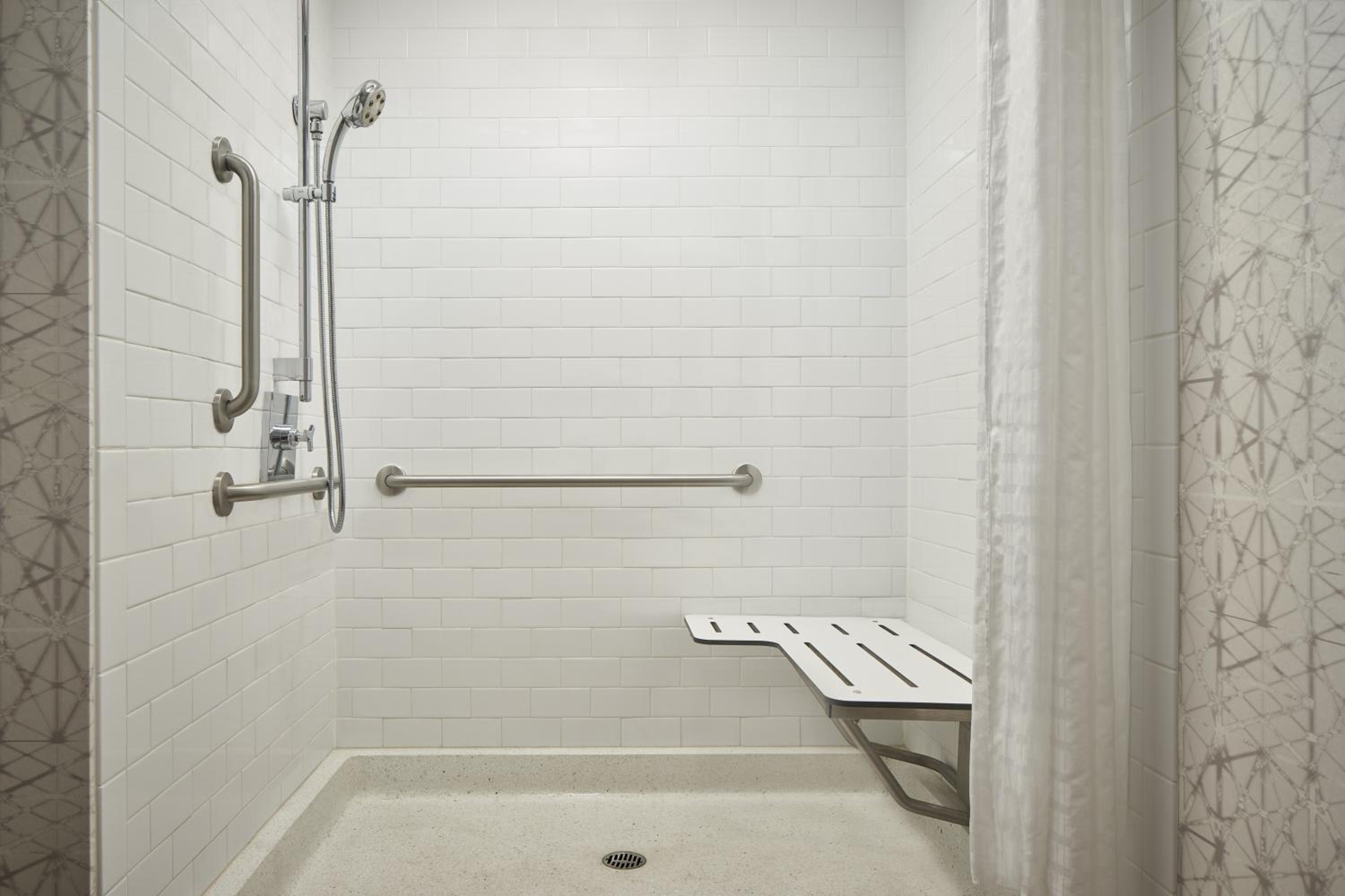 One-Bedroom King Suite with Private Sofa Bed and Atrium View - Mobility and Hearing Accessible with Roll-in Shower photo 1