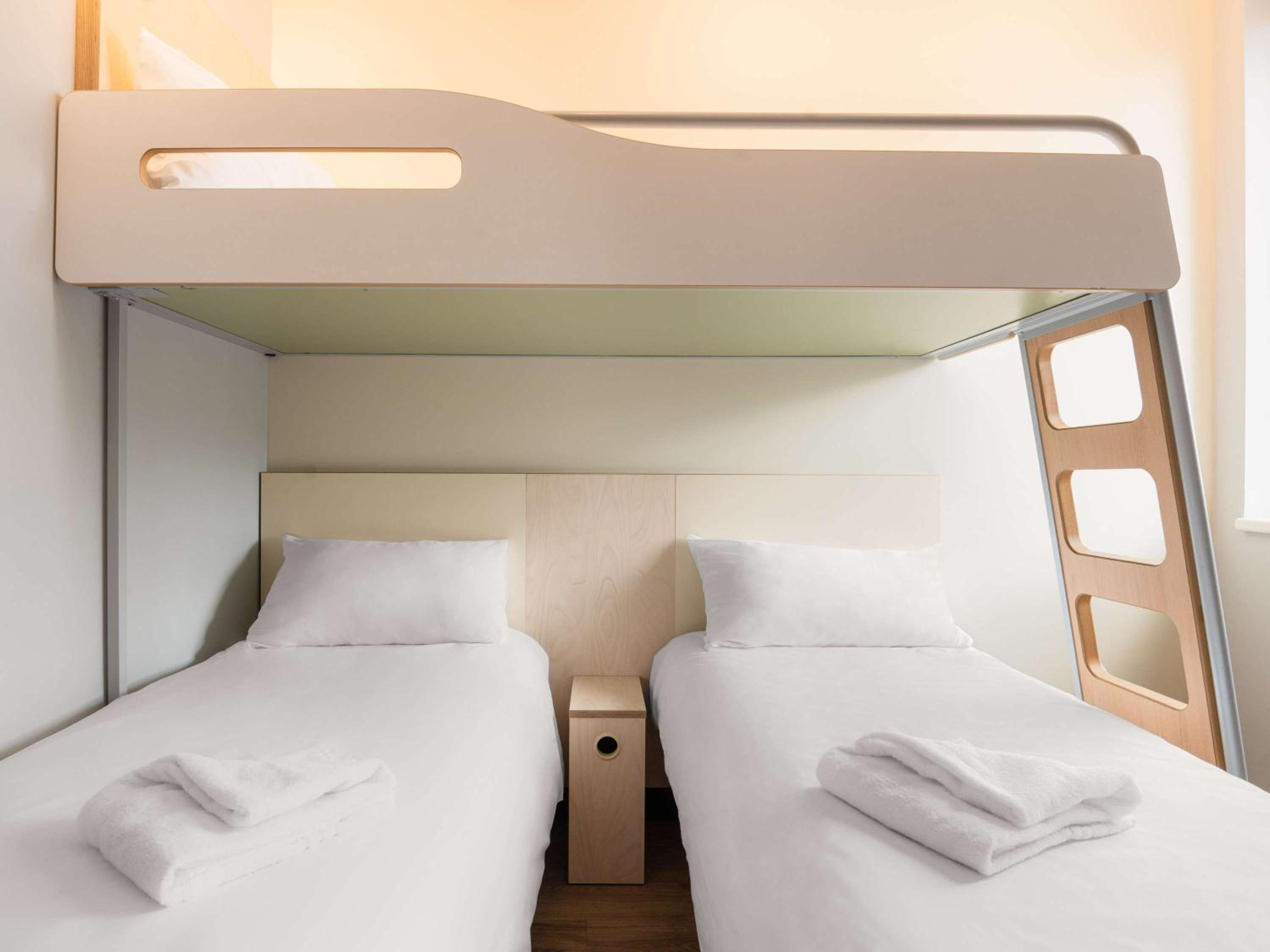 Standard Room with Two Single Beds and One Bunk Bed - Photo 1
