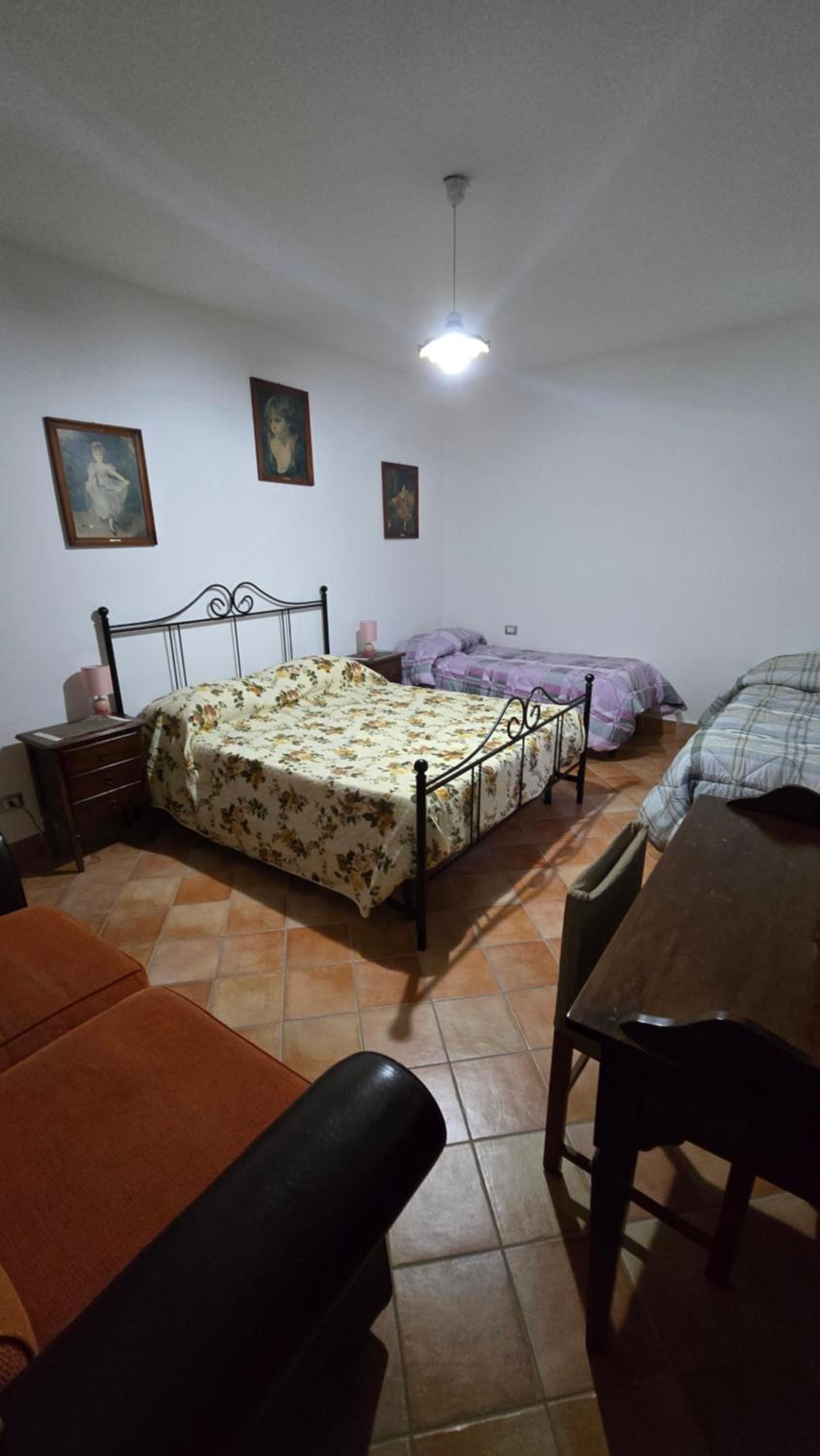 Economy Quadruple Room With Shared Bathroom