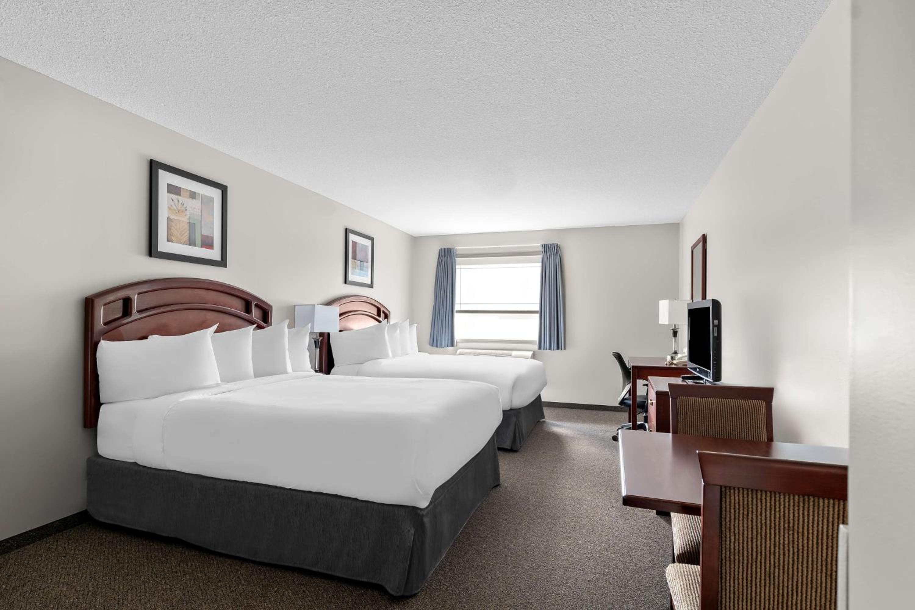 Queen Room with Two Queen Beds - Photo 1