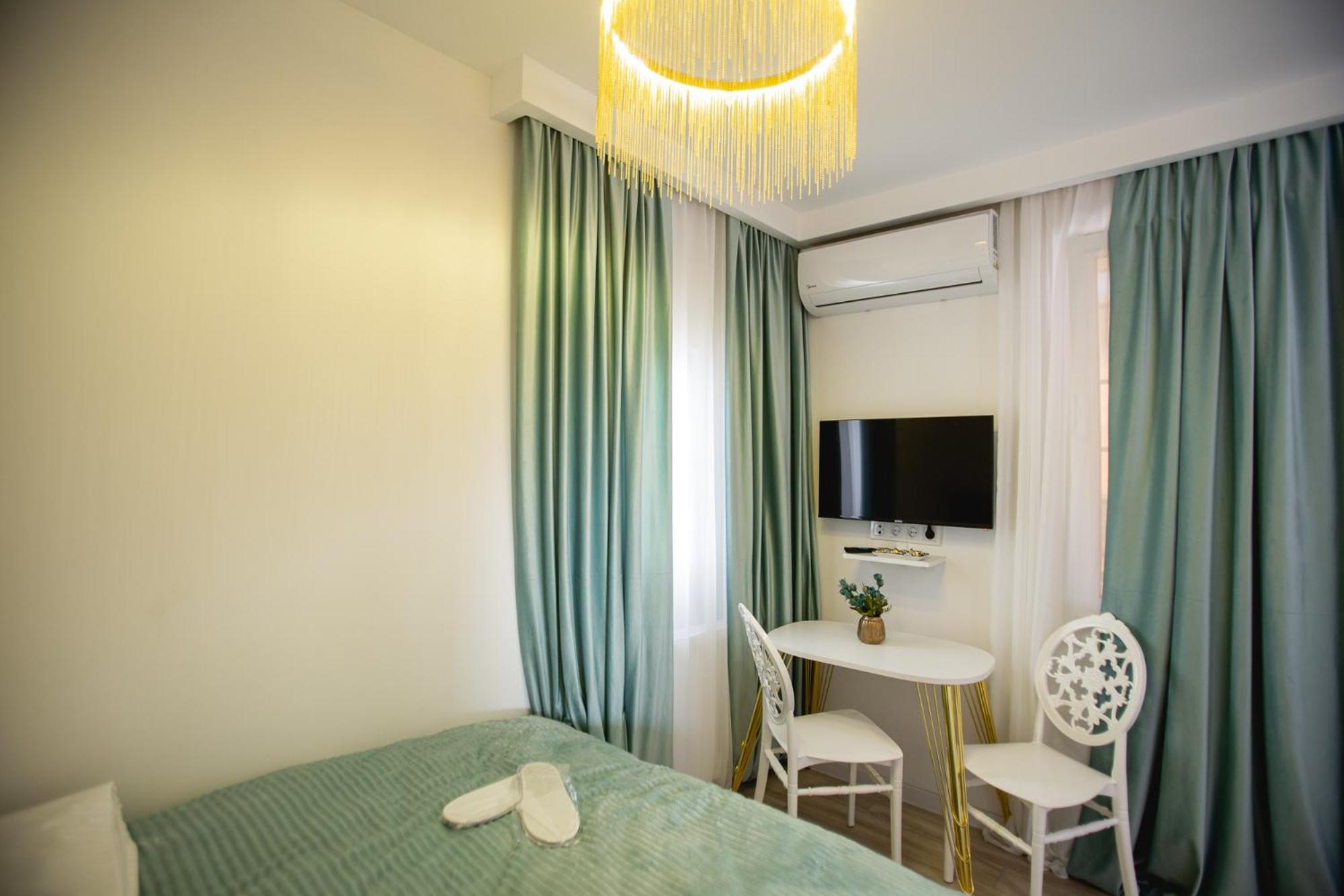 One-Bedroom Apartment with Balcony and City View