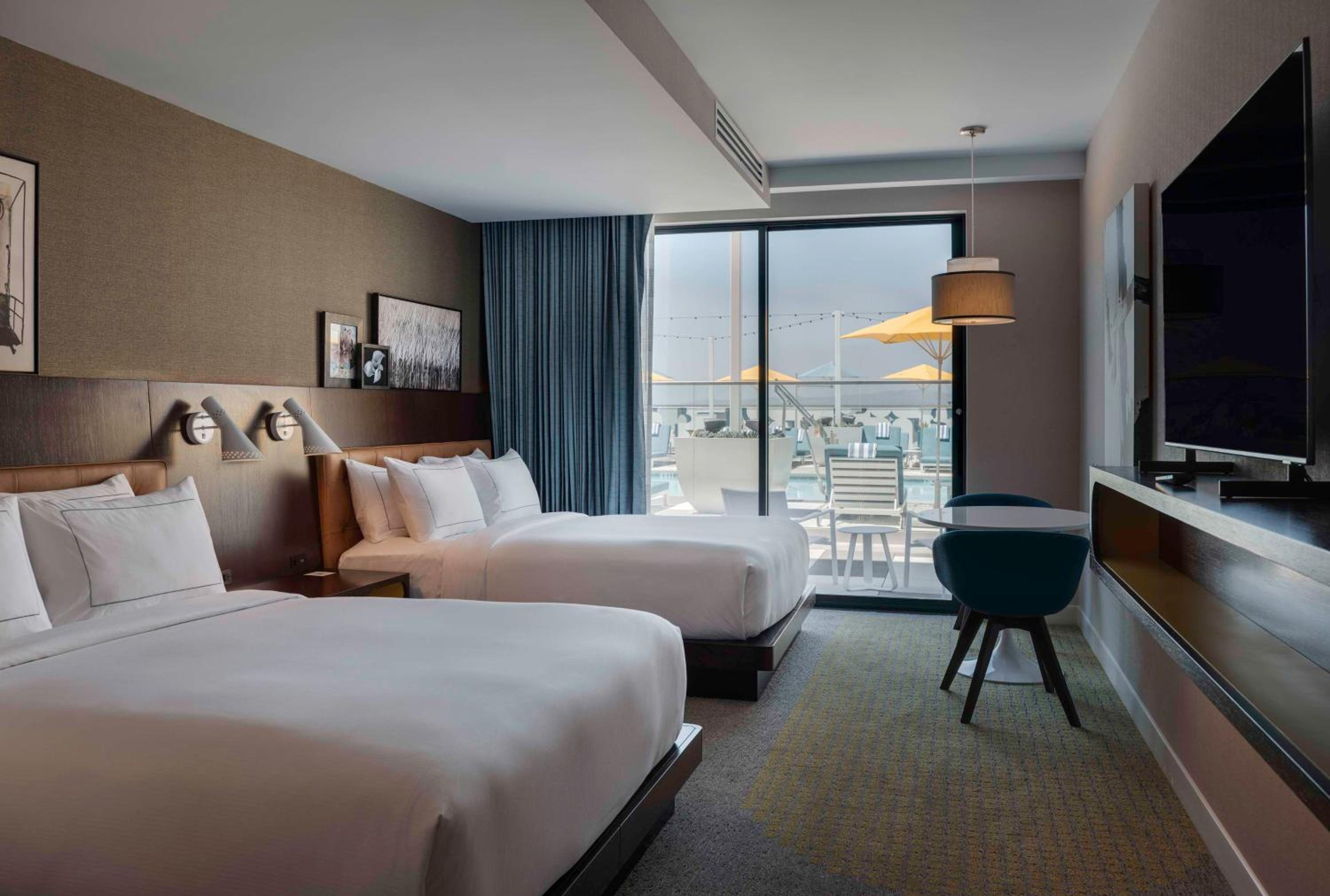 Queen Room with Two Queen Beds and Poolside Patio