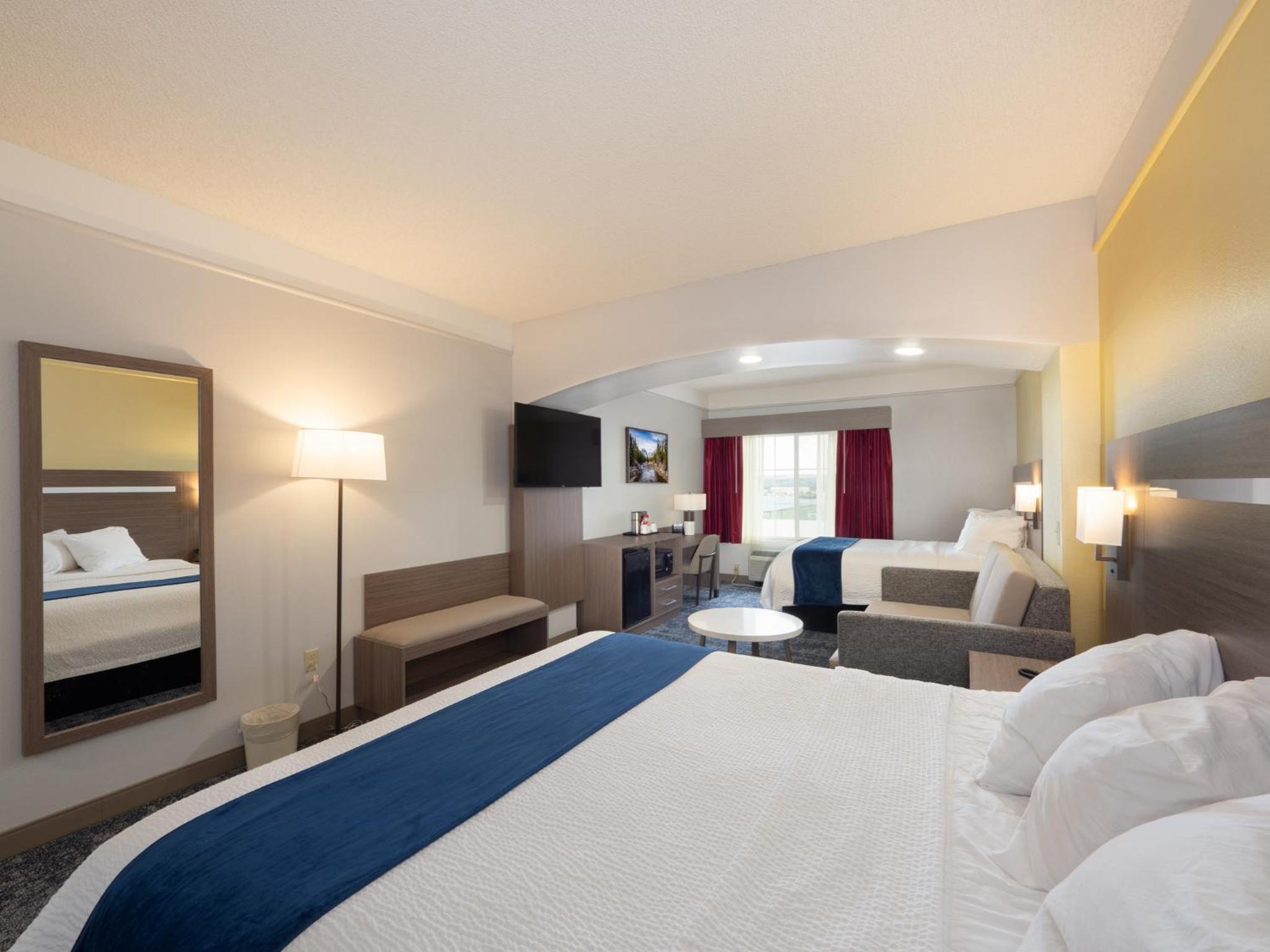 Larger Room with One King and One Queen Bed and Sofa - Non-Smoking - Photo 7