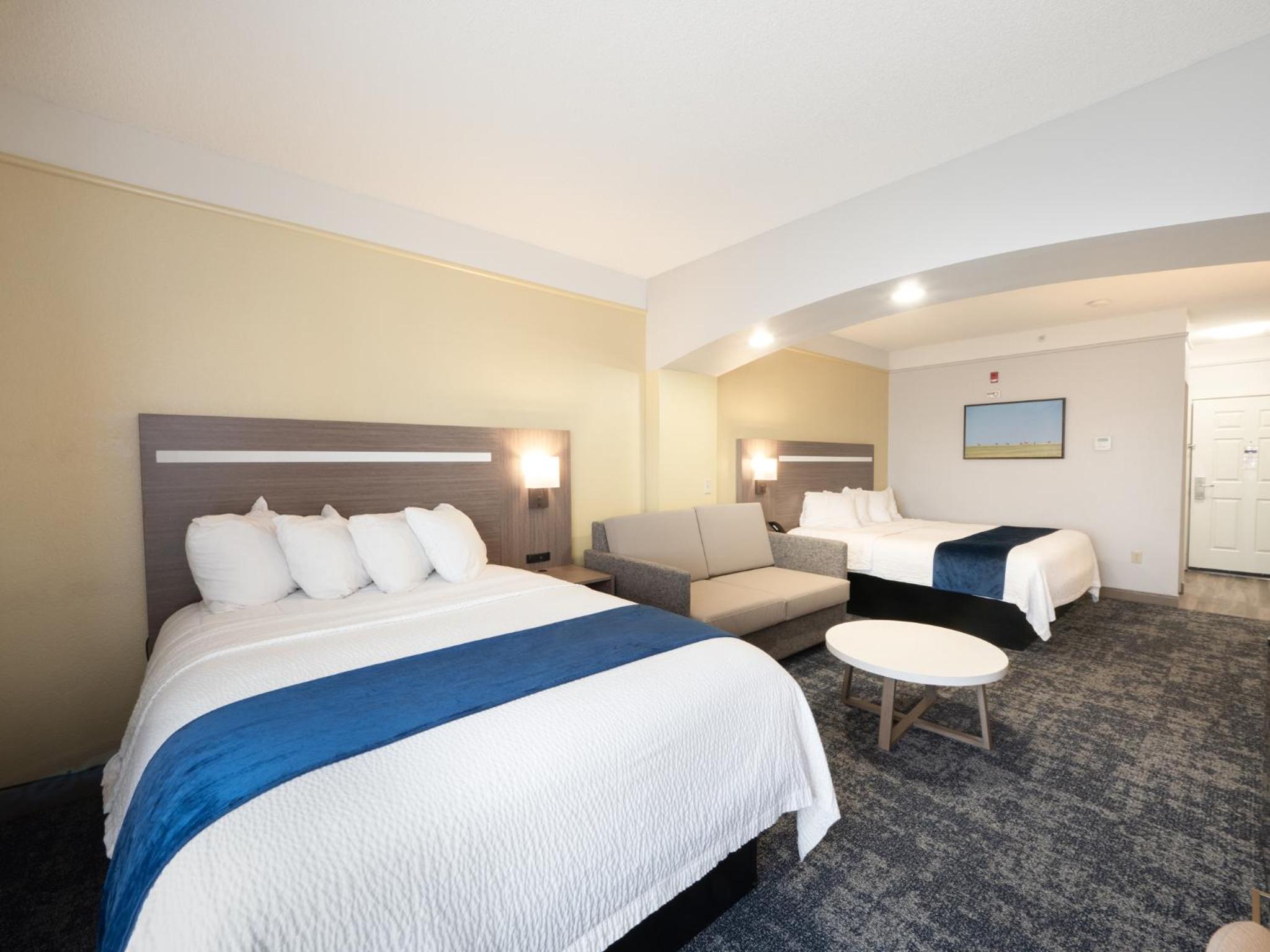 Larger Room with One King and One Queen Bed and Sofa - Non-Smoking - Photo 8