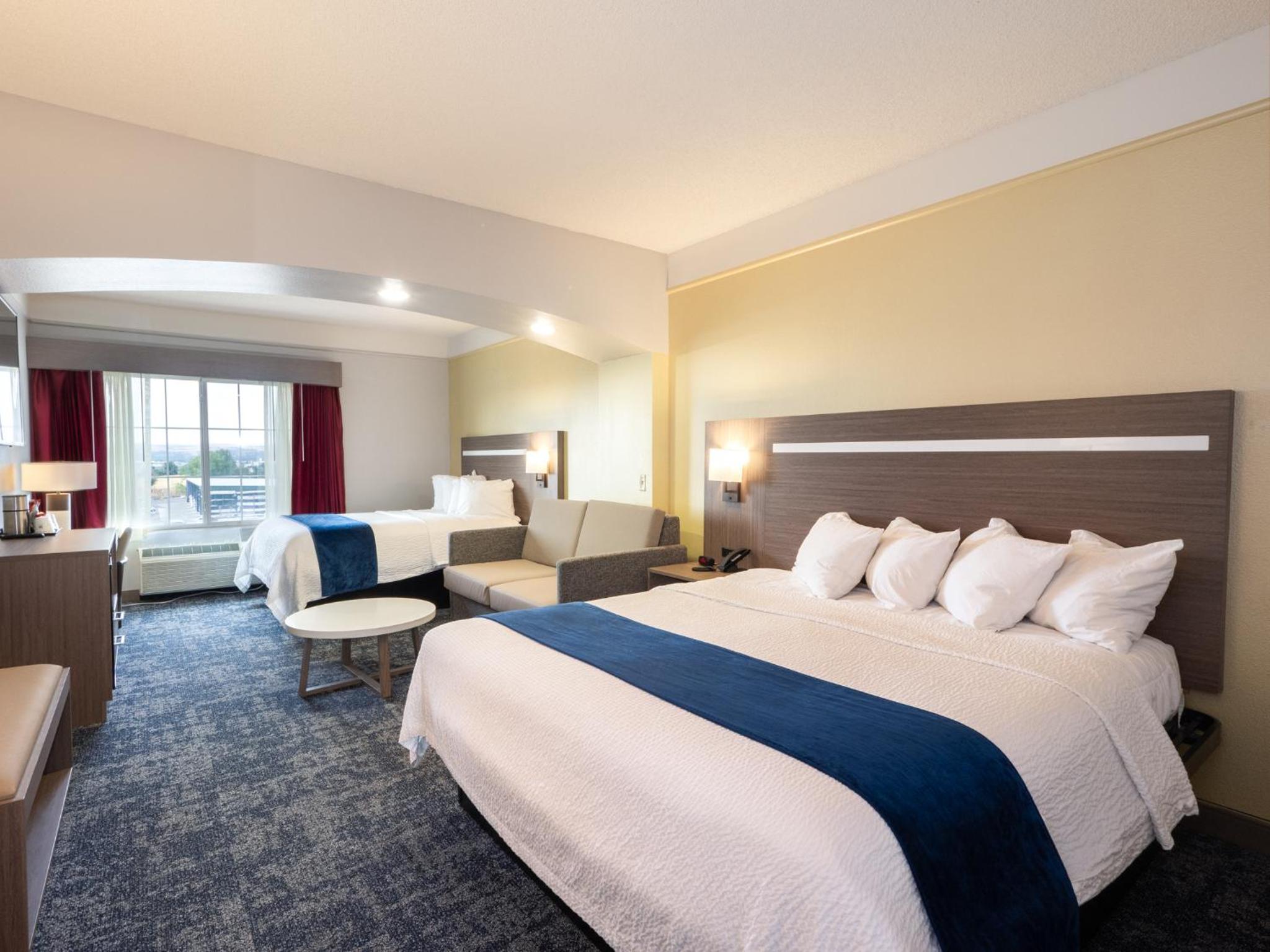 Larger Room with One King and One Queen Bed and Sofa - Non-Smoking - Photo 9