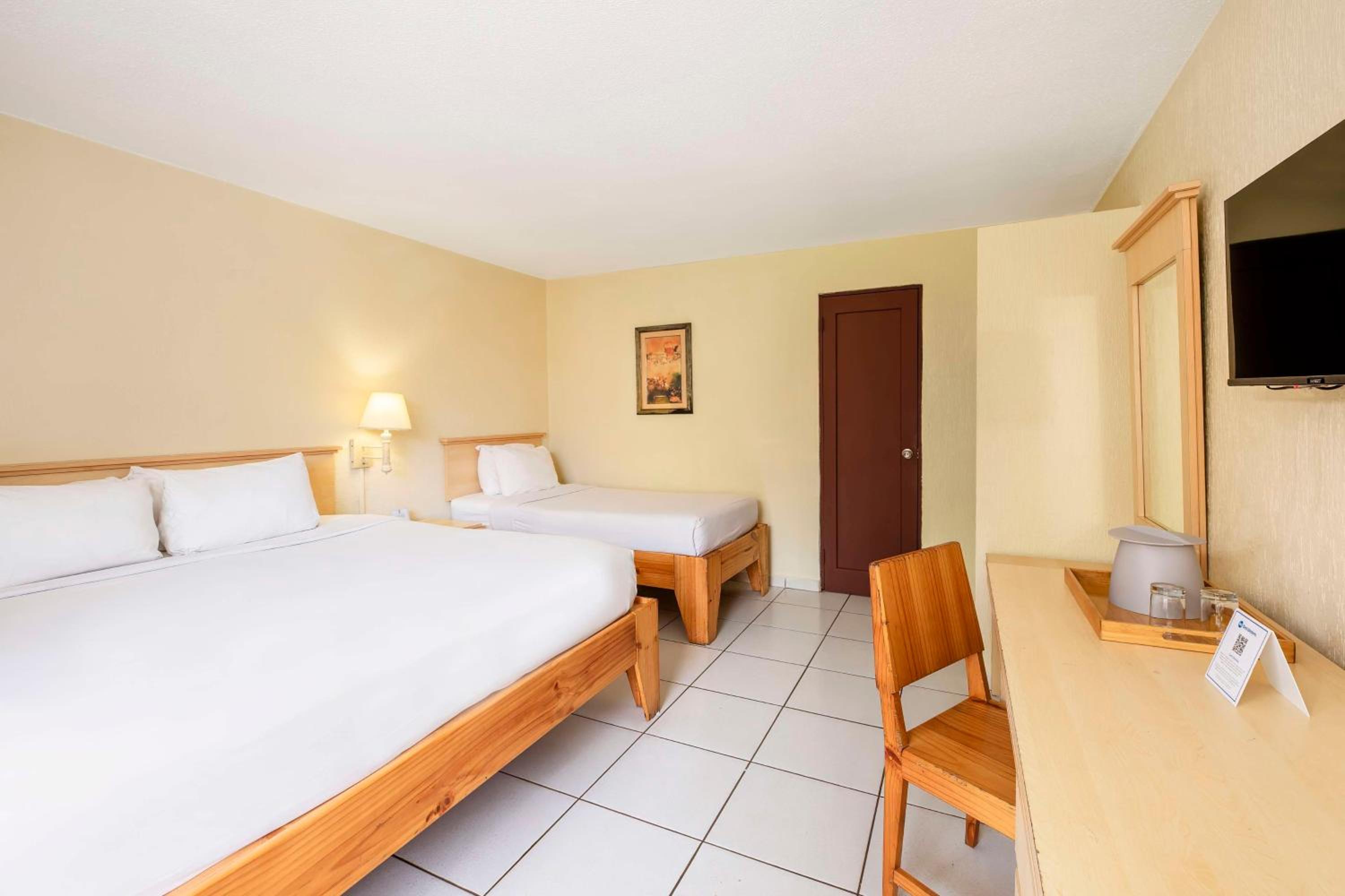 Room with One King and One Single Bed and Garden View - Non-Smoking