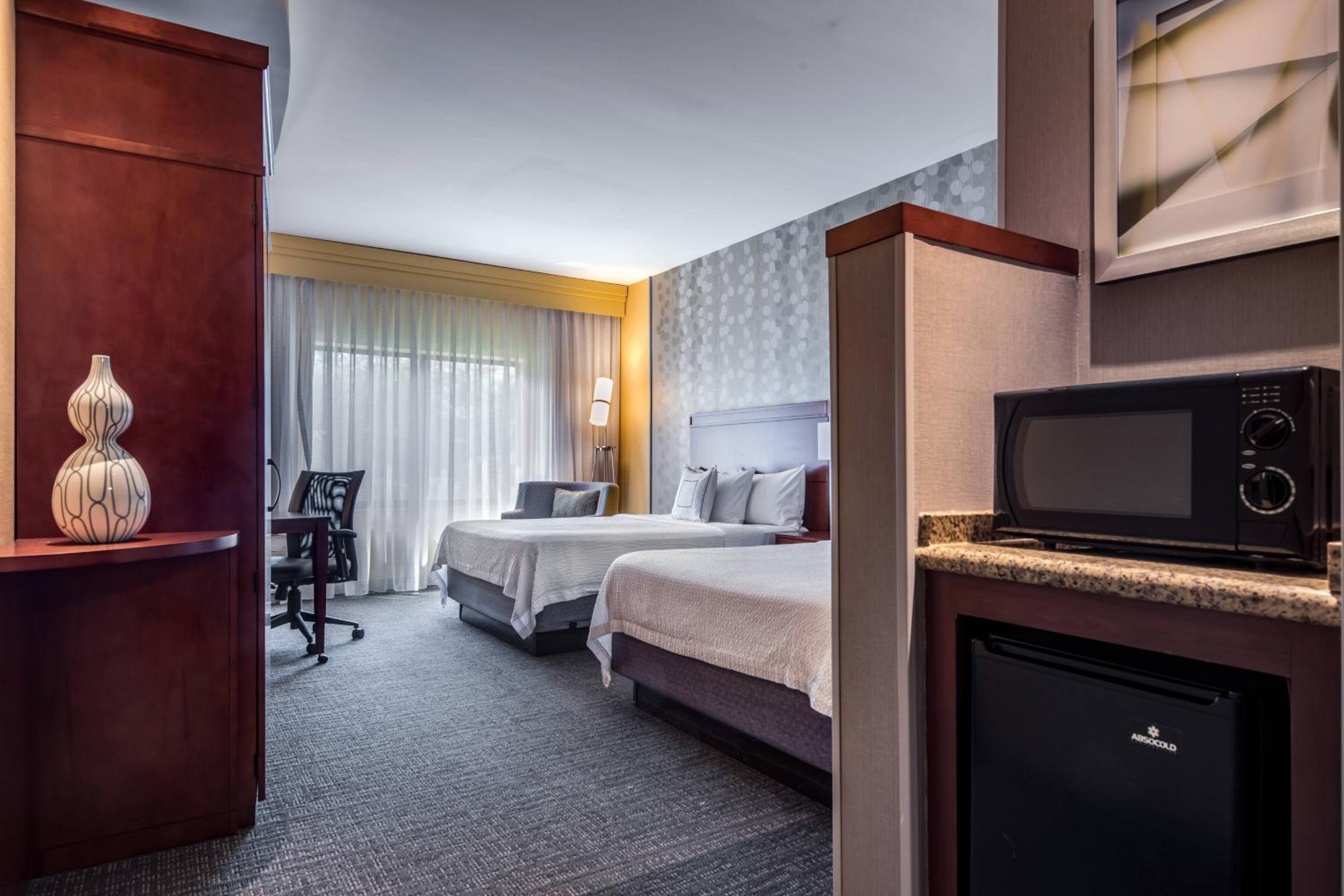 Deluxe Queen Room with Two Queen Beds - Photo 1