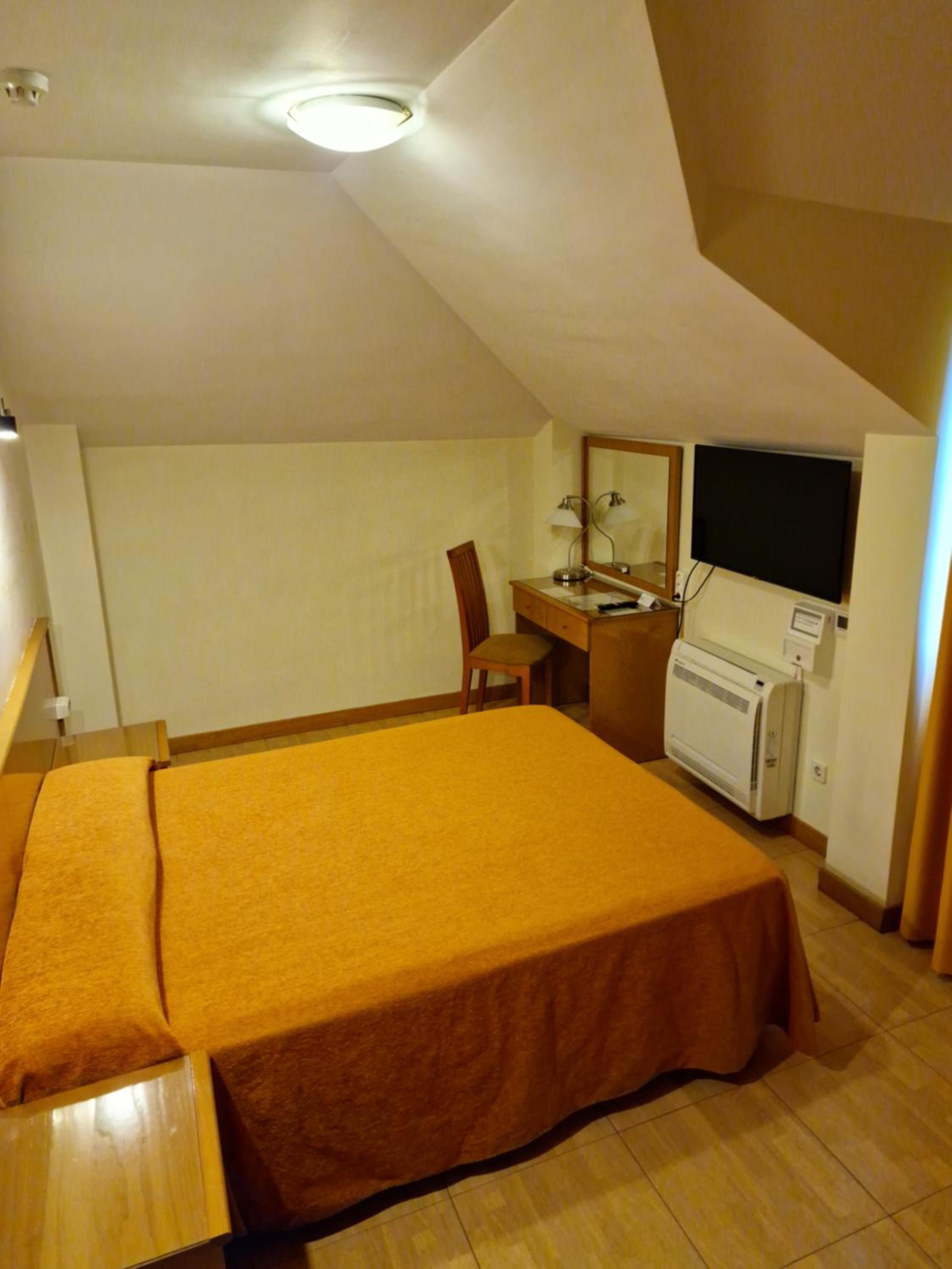 Habitación Estándar con Cama Queen