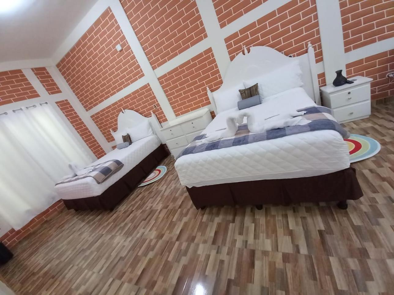 Deluxe Queen Room With Two Queen Beds photo 1