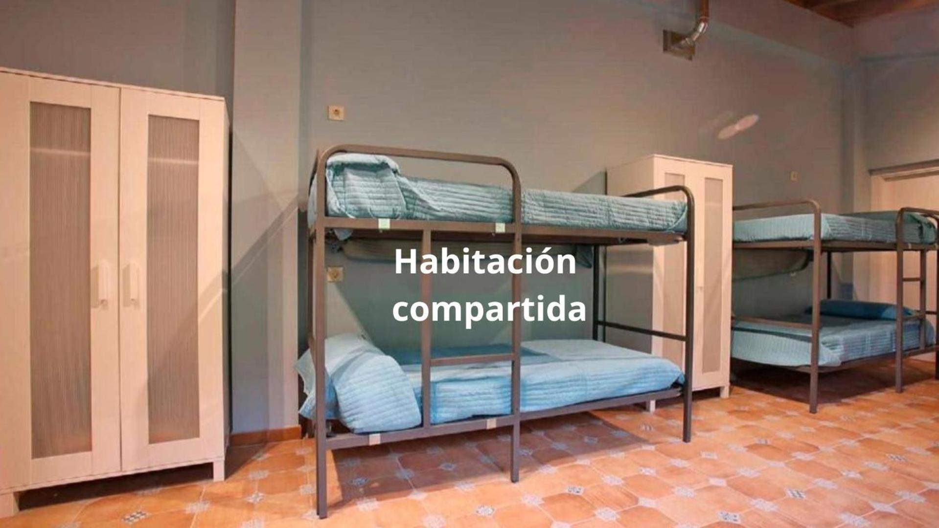 Cama individual en habitación compartida mixta
