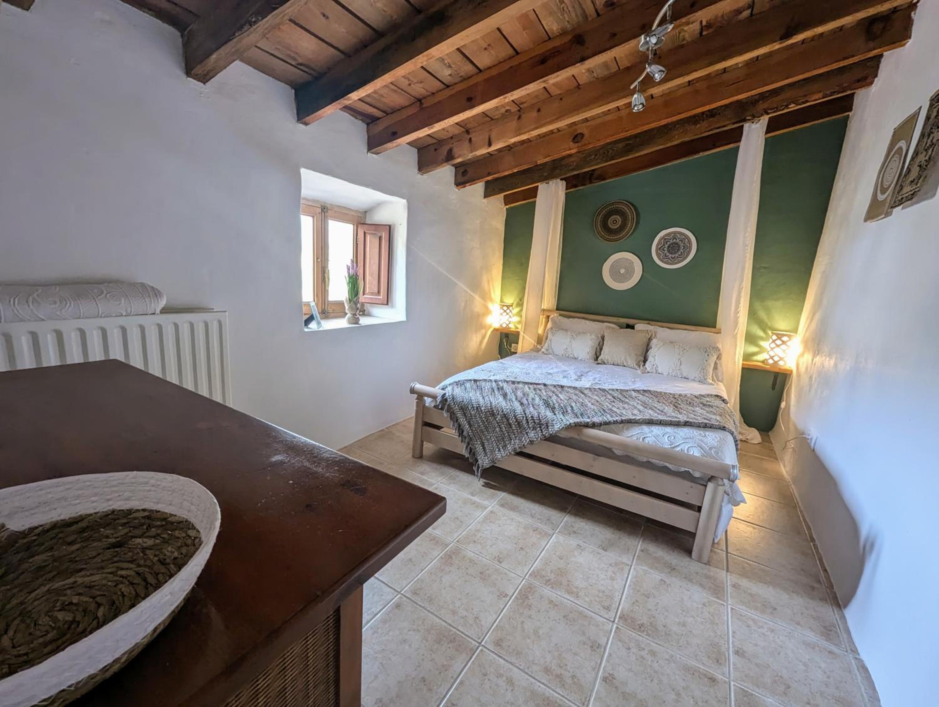 Habitación Queen con Baño Compartido