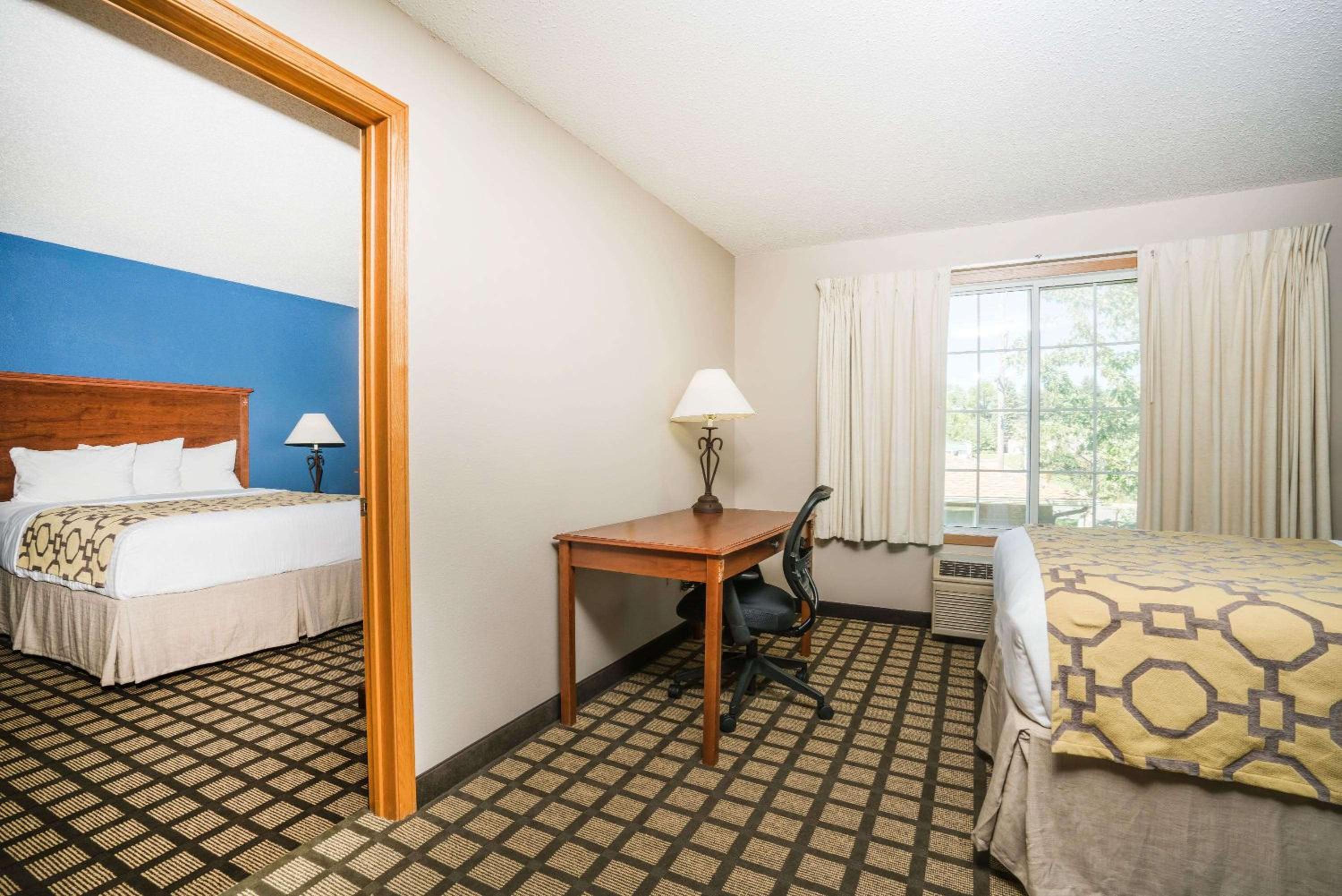 Queen Suite with Two Queen Beds and Sofa - Non-Smoking photo 1