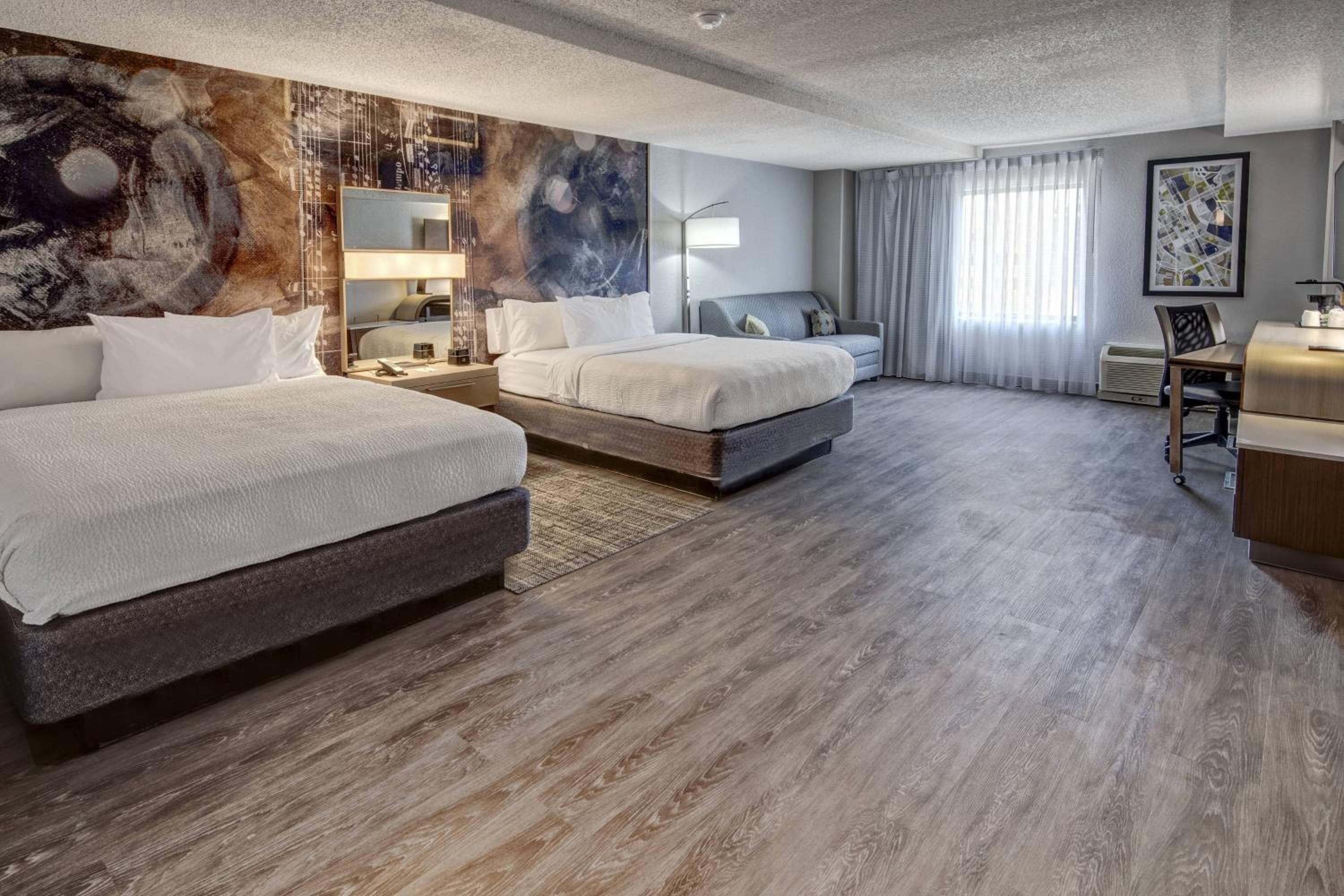 Larger Studio with Two Queen Beds and Sofa Bed - Hearing Accessible - Photo 1