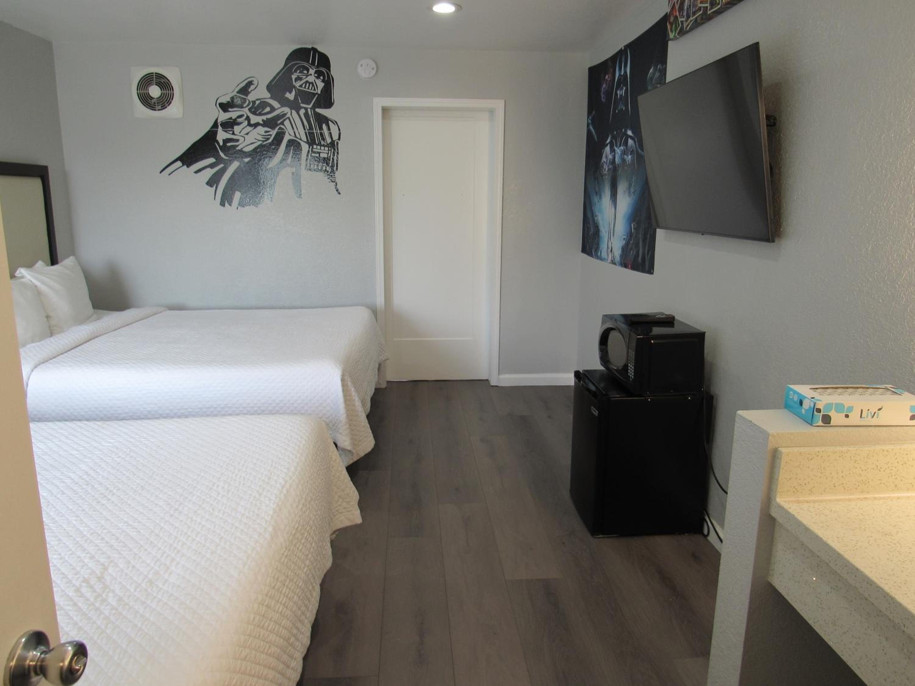 Efficiency Queen Suite with Three Queen Beds - Non-Smoking - Photo 1