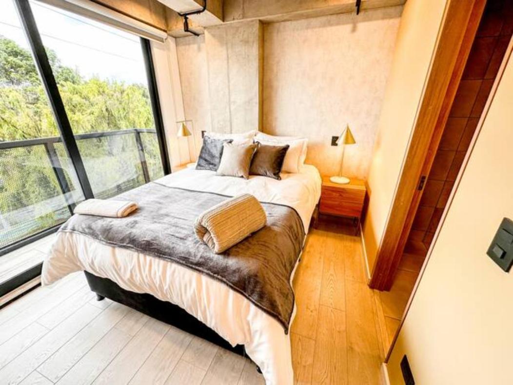 One-Bedroom Apartment with Balcony and City View