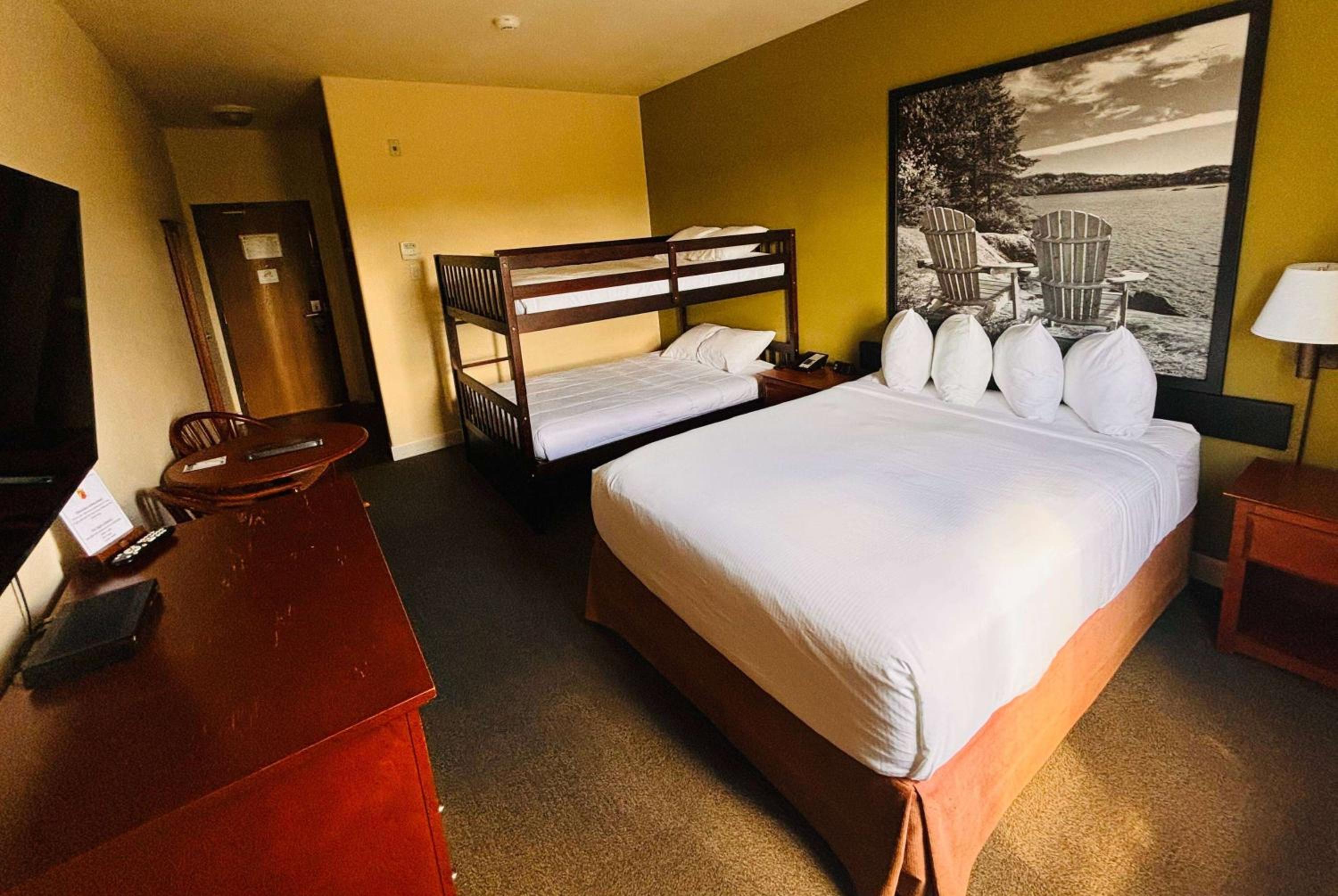 Efficiency Room with One Queen Bed and One Double Bunk Bed - Non-Smoking - Photo 1