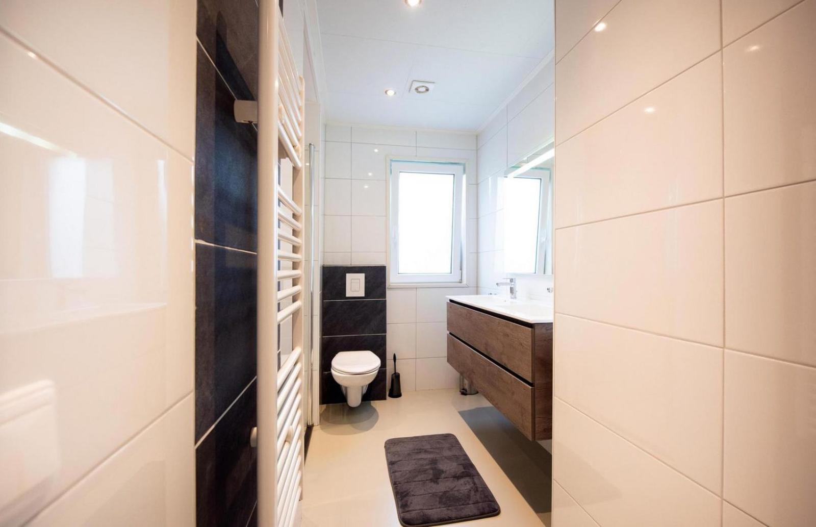Three-Bedroom House - Photo 16
