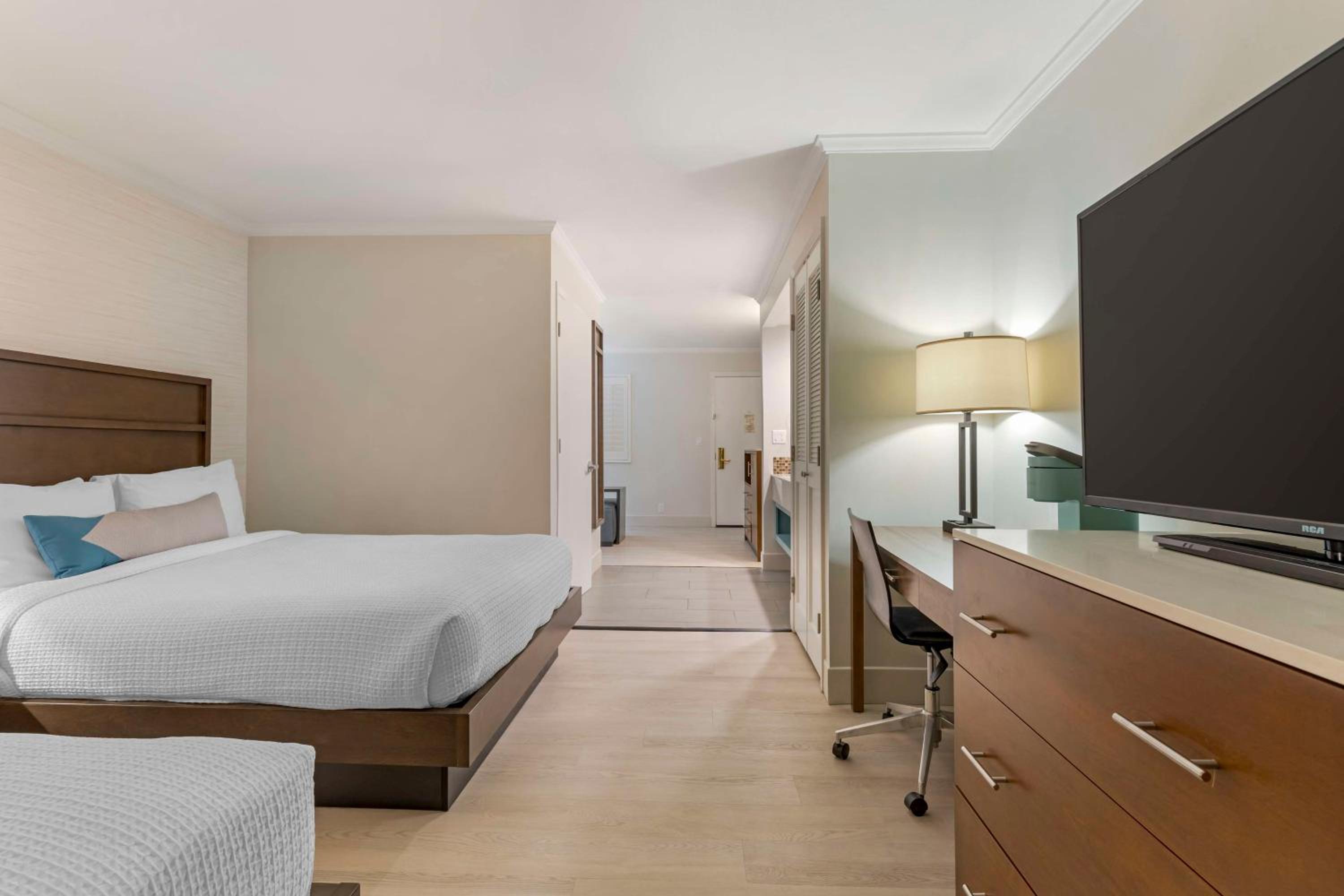 Queen Room with Two Queen Beds and Sofa - Photo 1