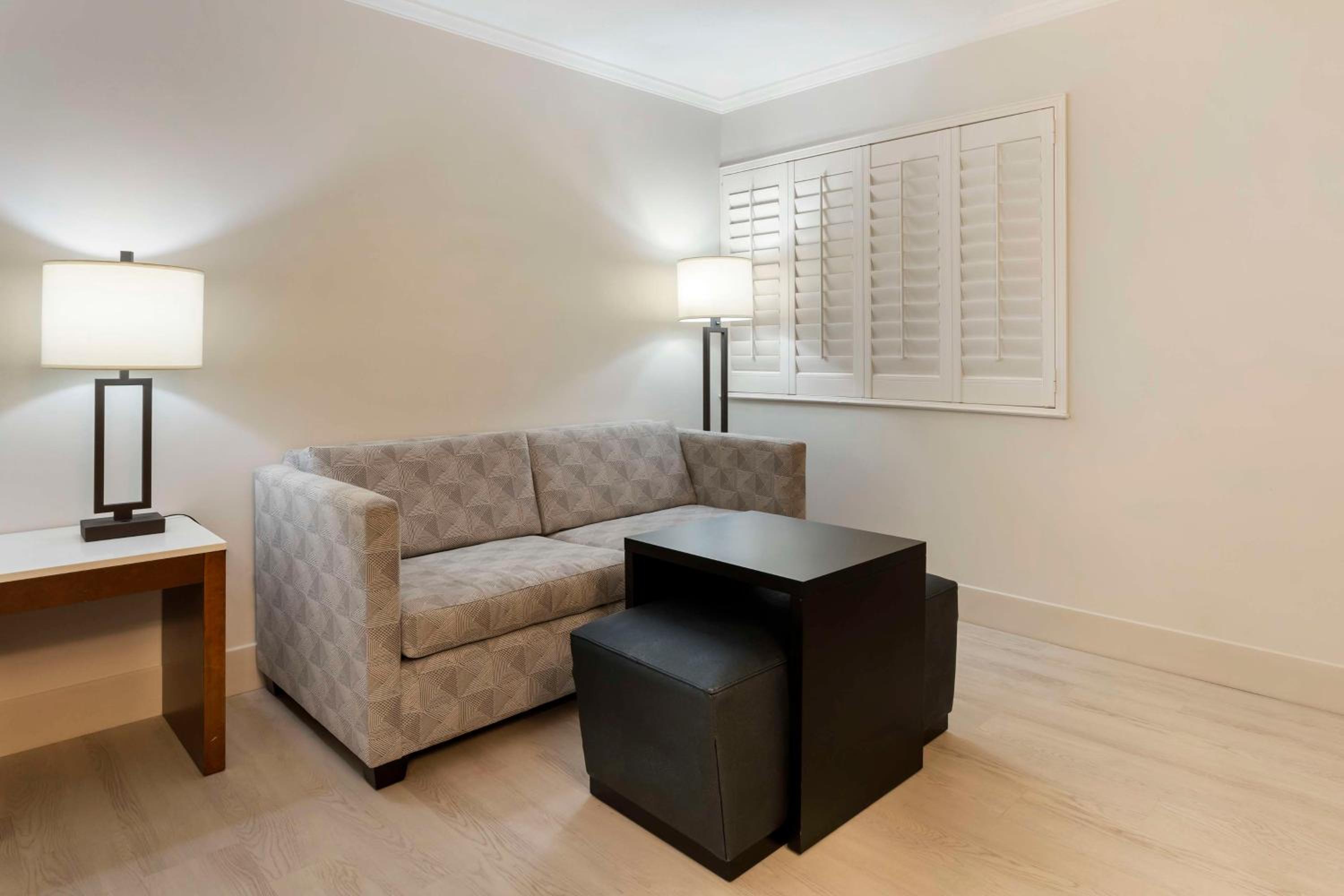 Queen Room with Two Queen Beds and Sofa - Photo 5