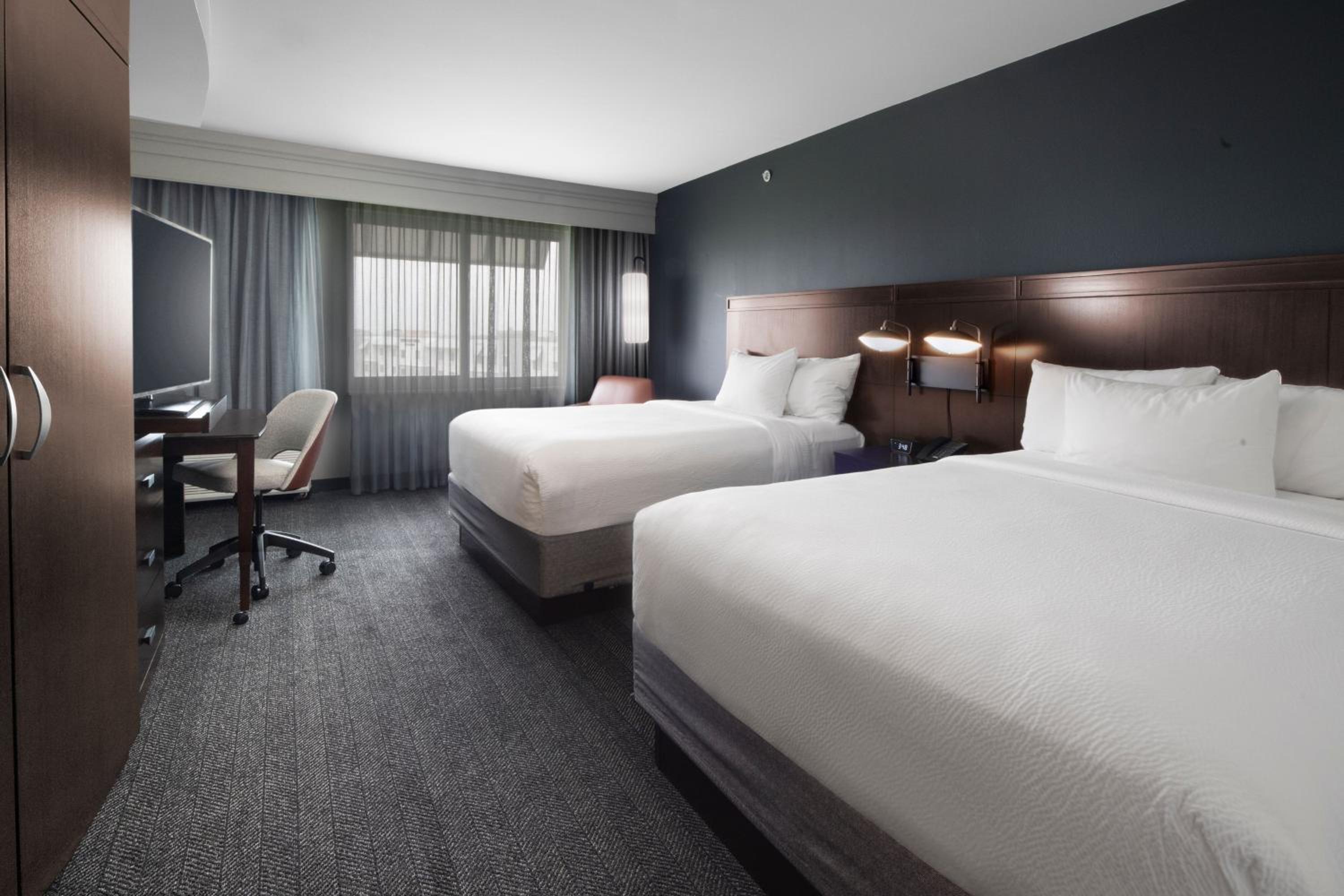 Queen Room with Two Queen Beds - Hearing Accessible photo 1