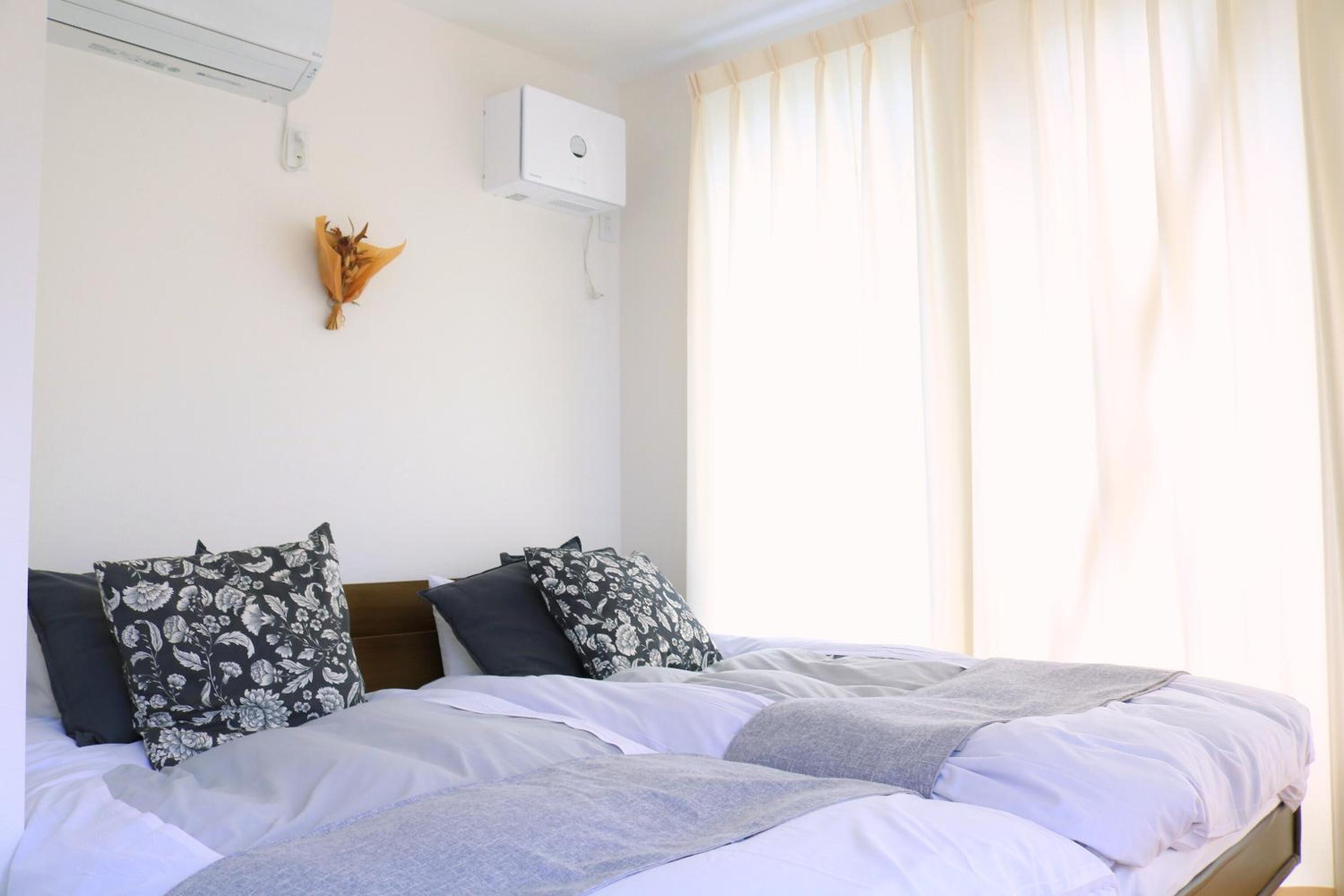 Three-Bedroom House - Photo 27