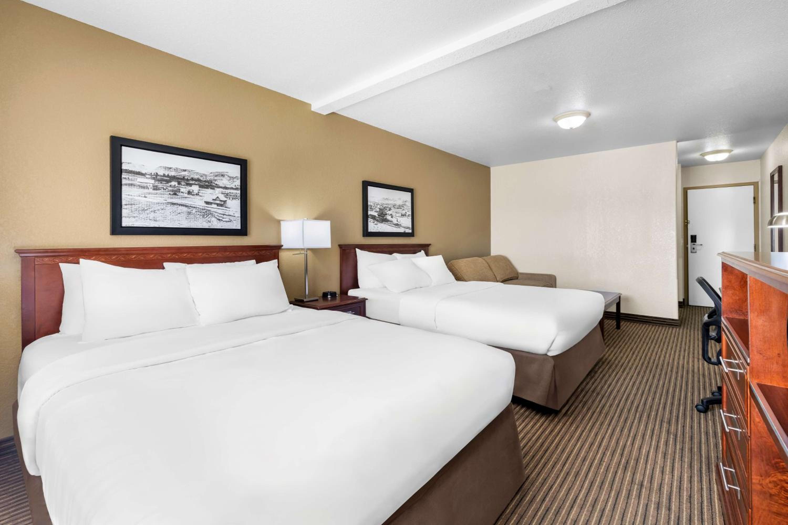 Queen Room with Two Queen Beds with Sofa Bed - Photo 1